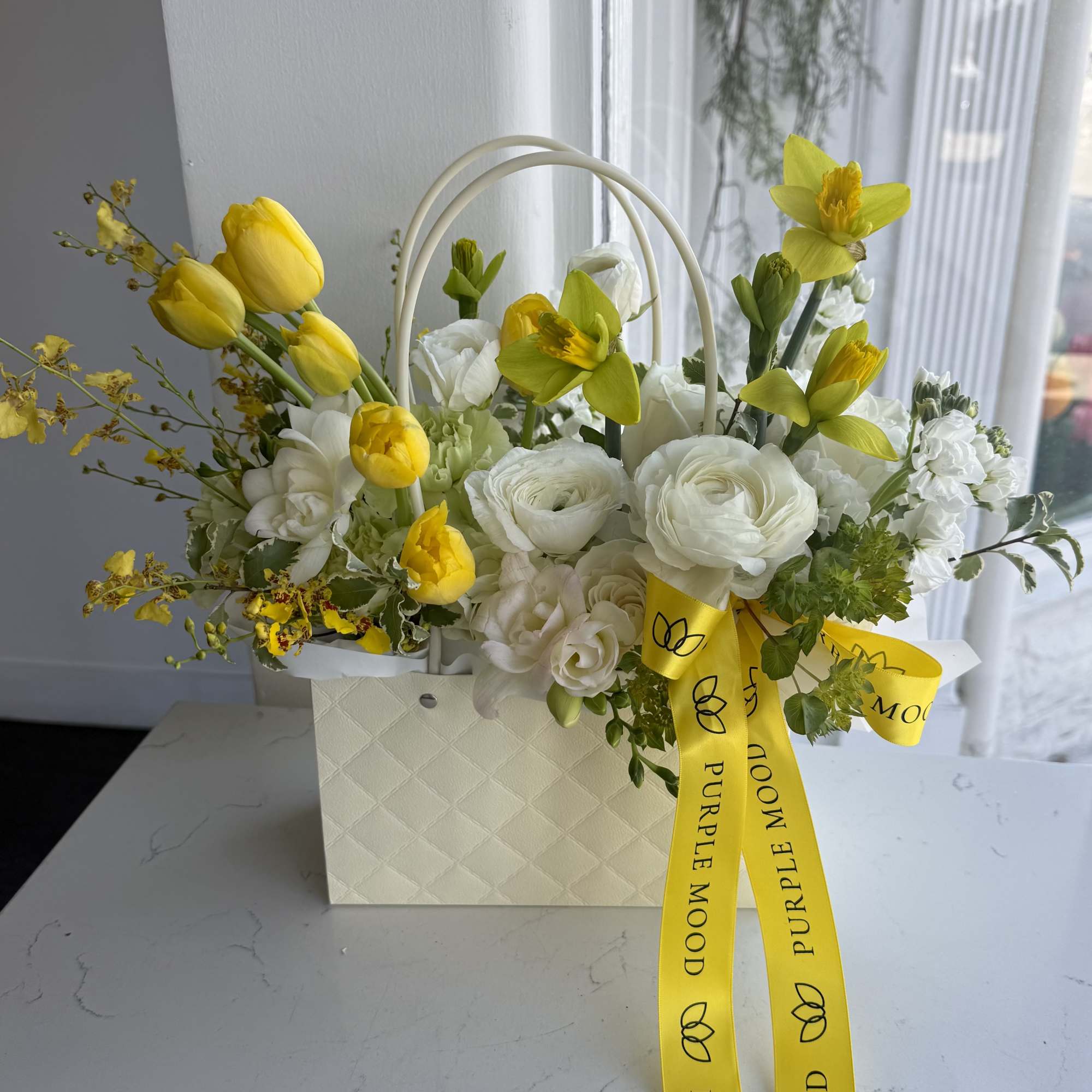 A bright and cheerful spring arrangement designed in our elegant mini handbag, photo 2 of 2