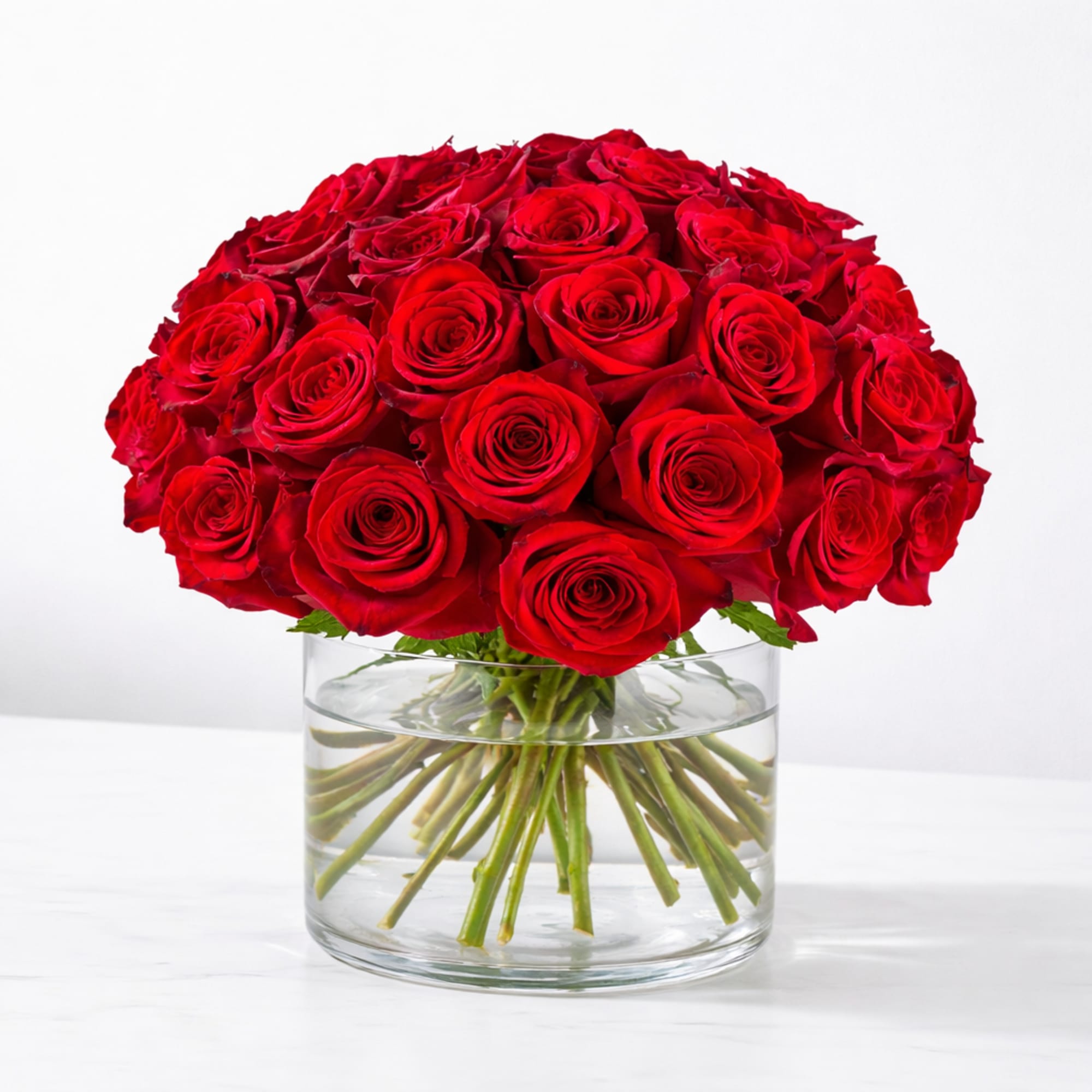 Red rose bouquet in a clear glass vase