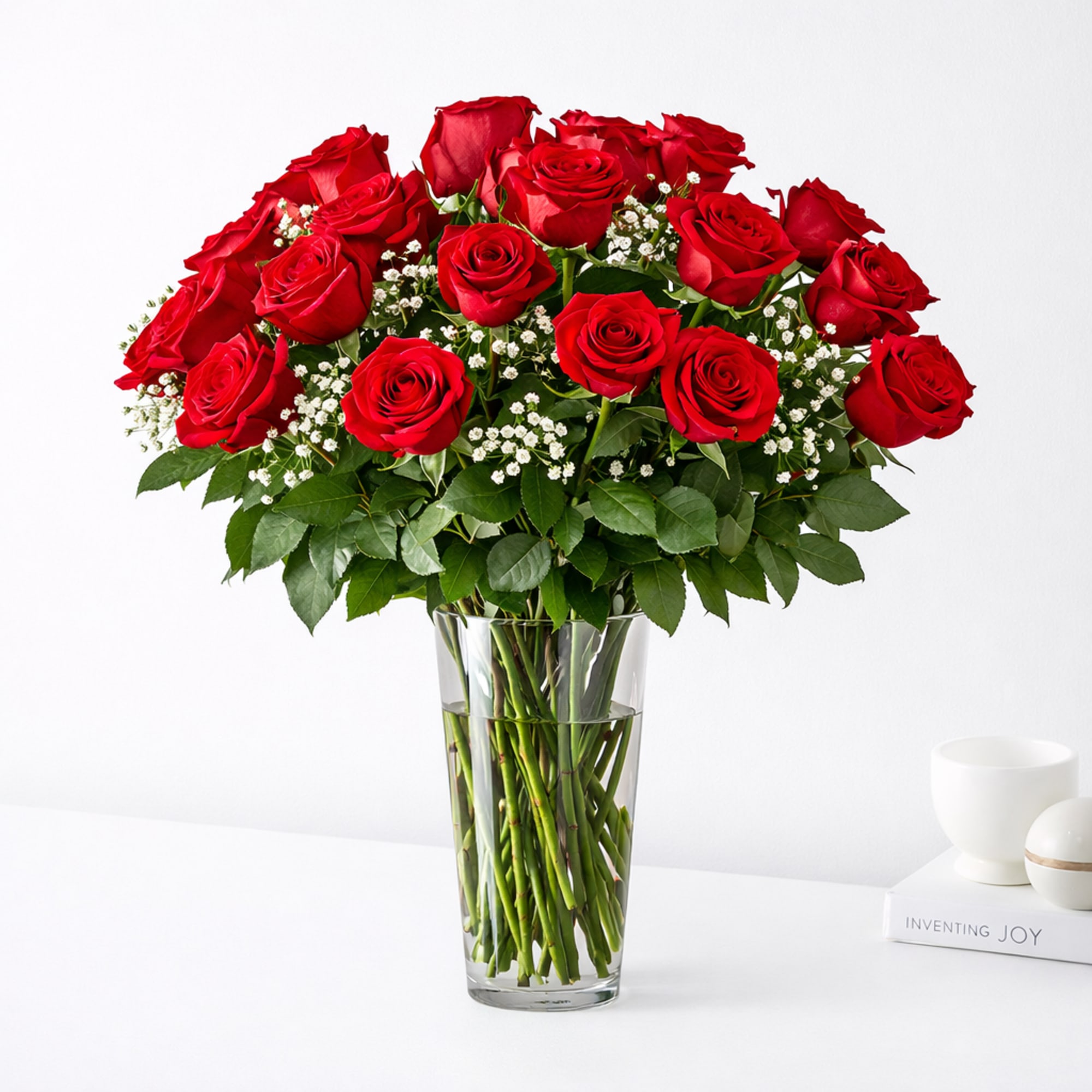 Bouquet of red roses in a clear glass vase