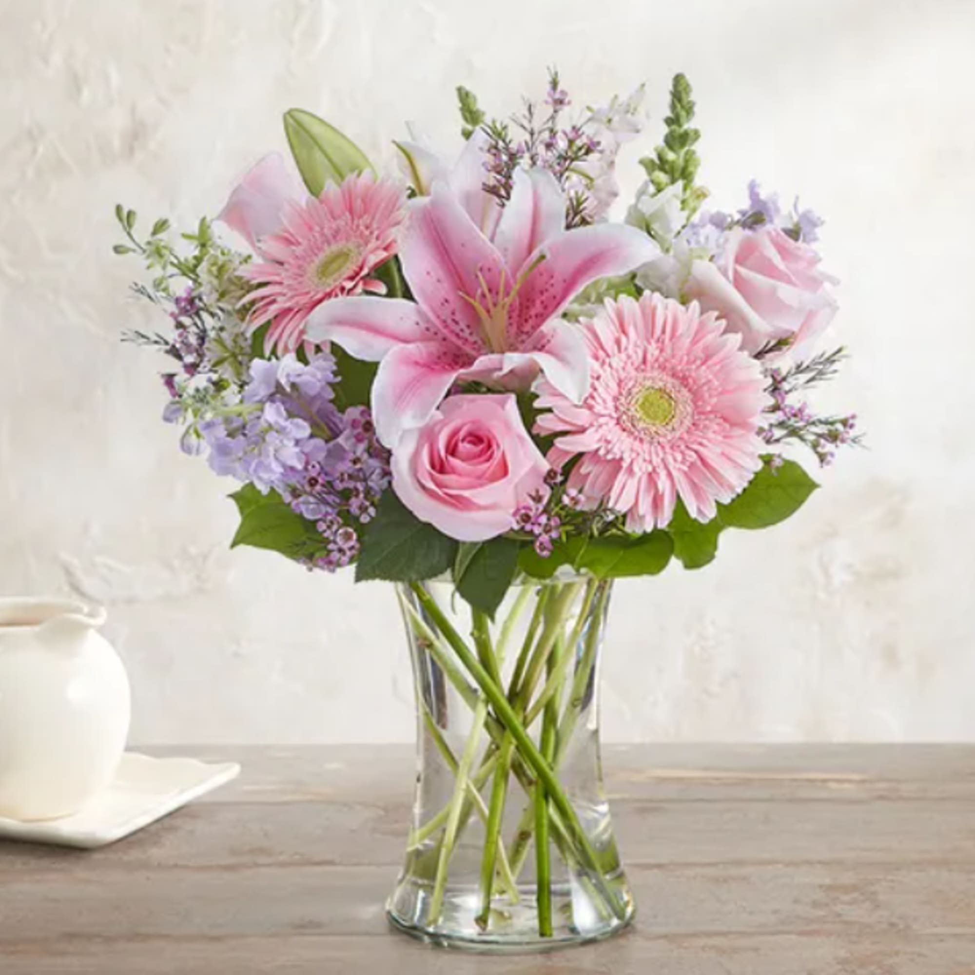 A soft mixed bouquet of available flowers.