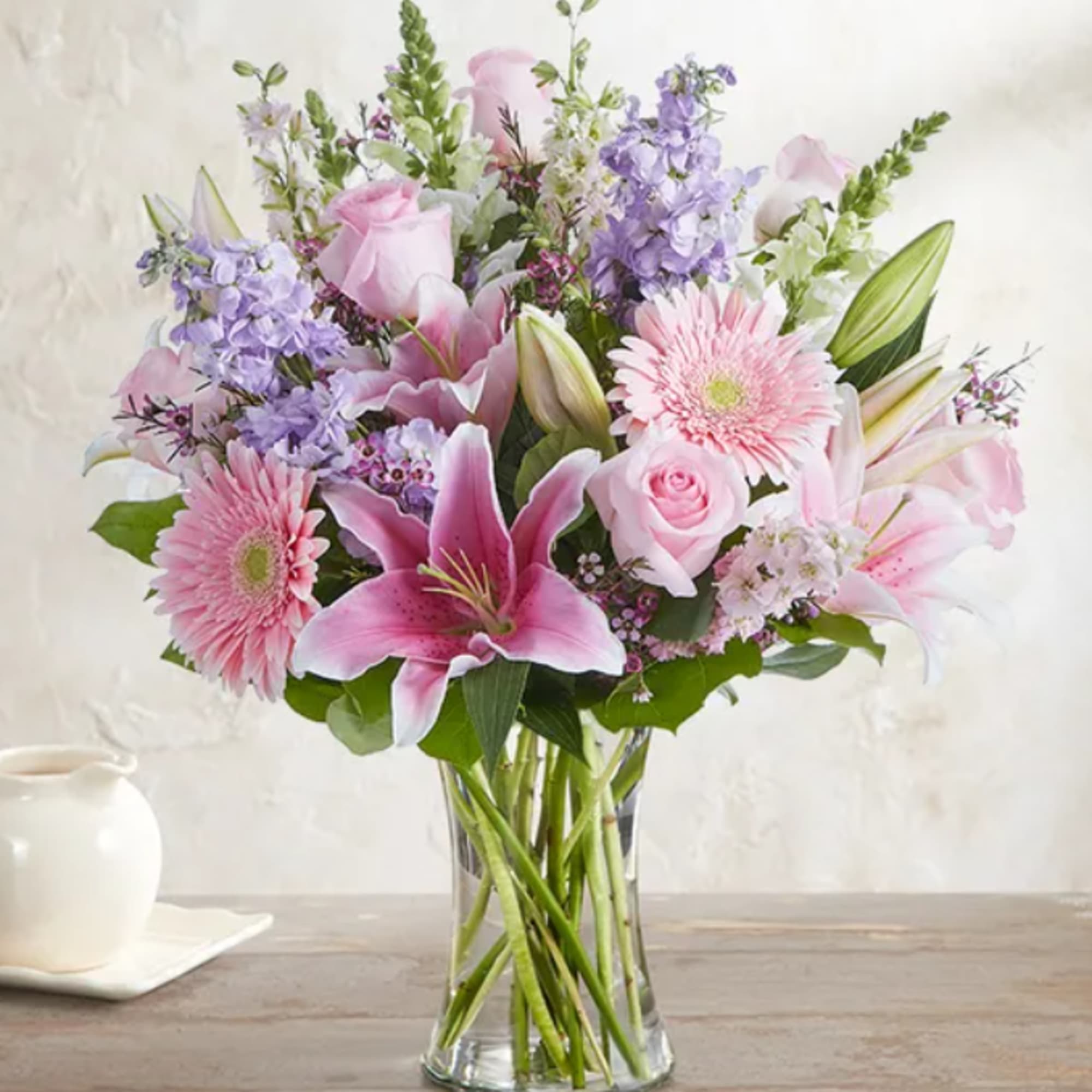 A soft mixed bouquet of available flowers.