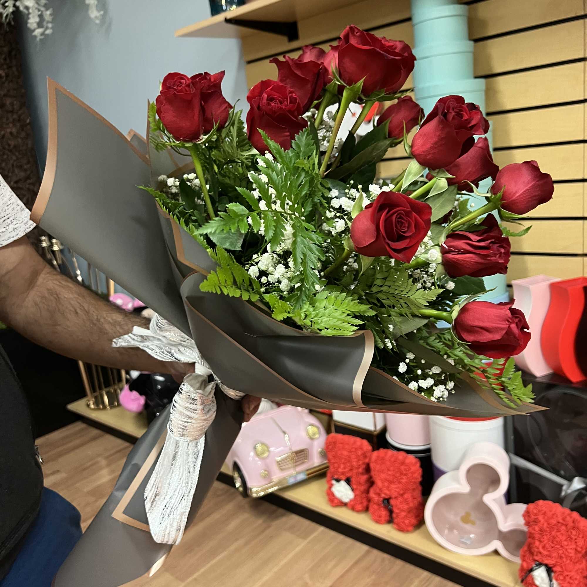 Hand bouquet of red roses and fillers, photo 2 of 2