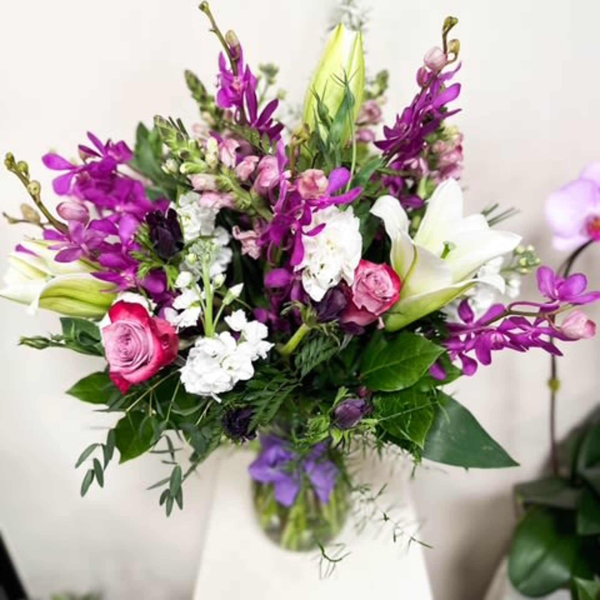 Elegant, vibrant, and unforgettable, Makara Orchid Majesty is a luxurious tall floral
