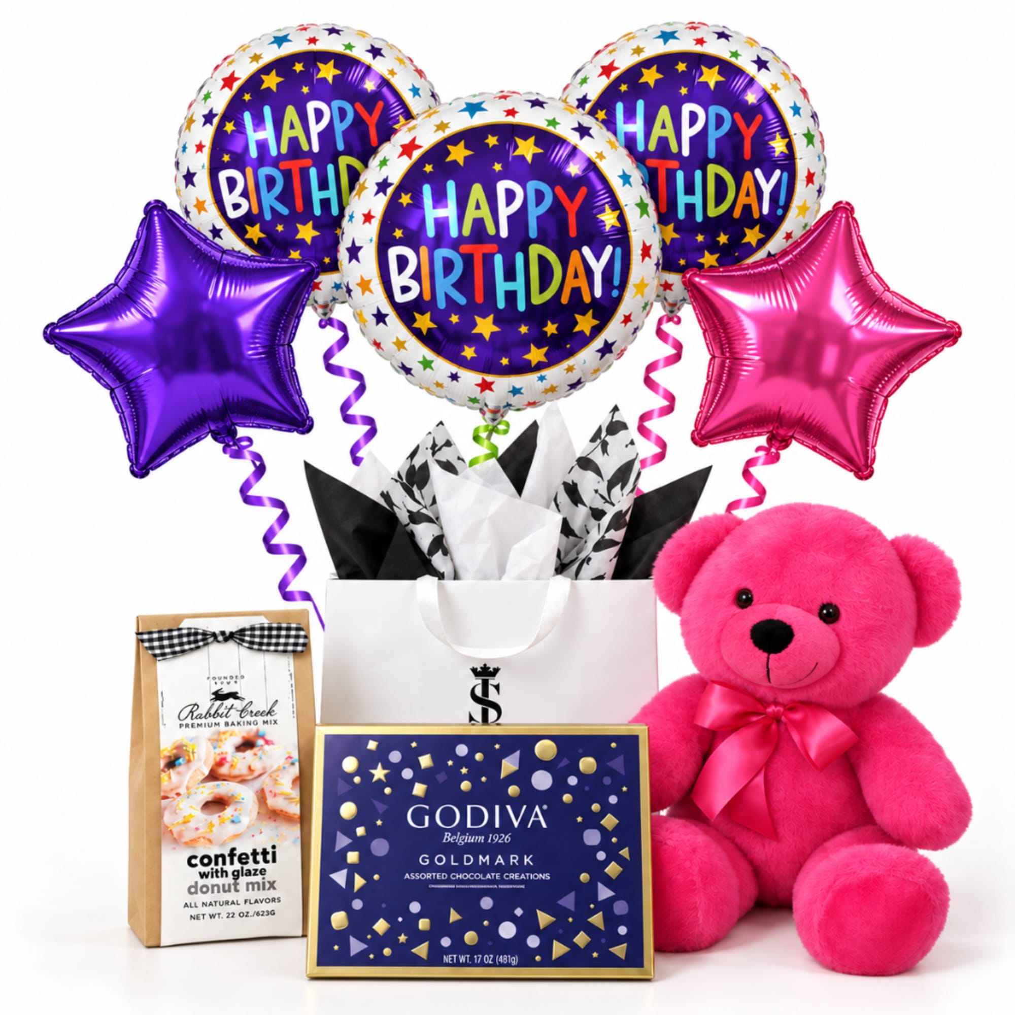 Birthday gift set with balloons, a pink teddy bear, chocolates, and donut mix