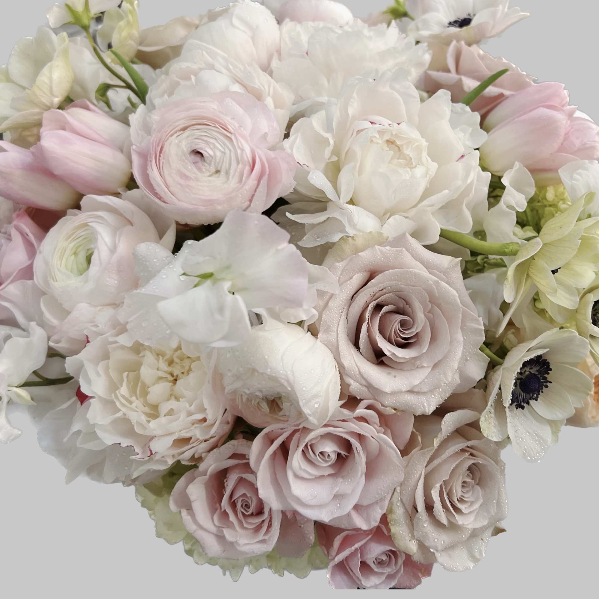 Bouquet of pale pink and white roses with white blooms
