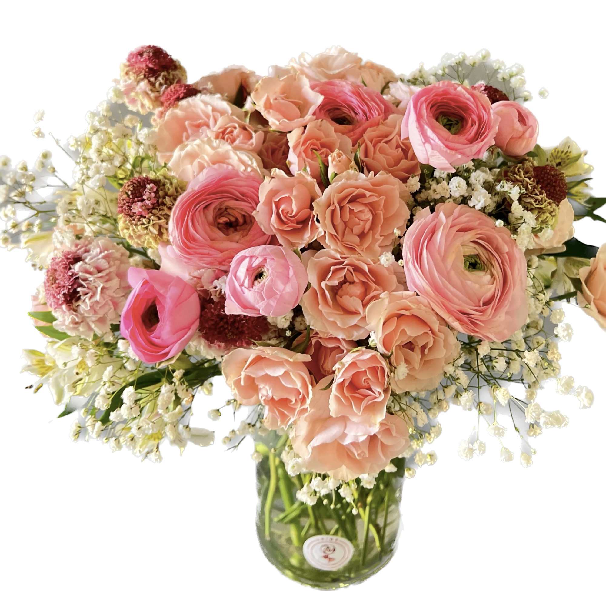 Pink and peach mixed bouquet in a glass vase