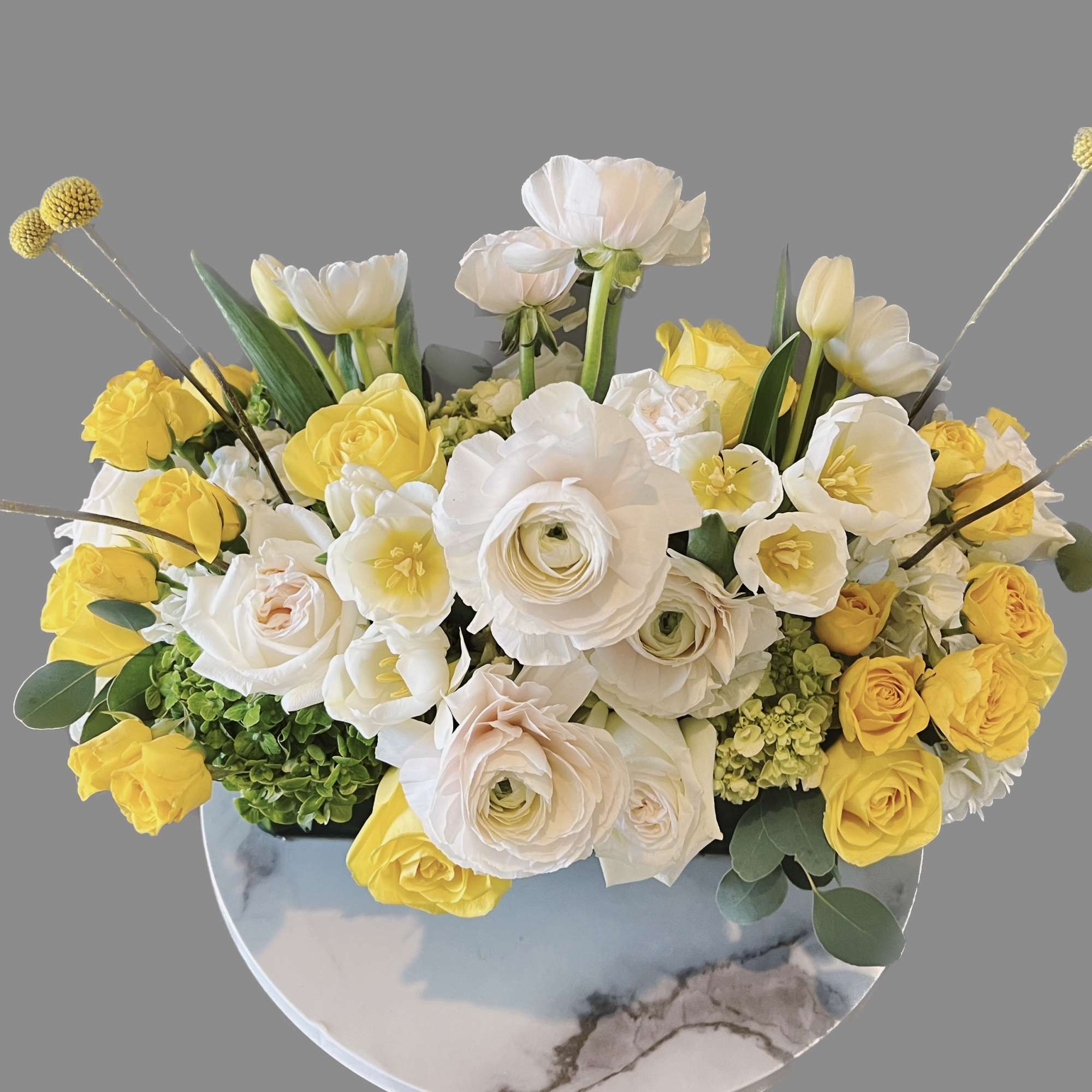 Yellow and white floral arrangement in a round vase, photo 2 of 2