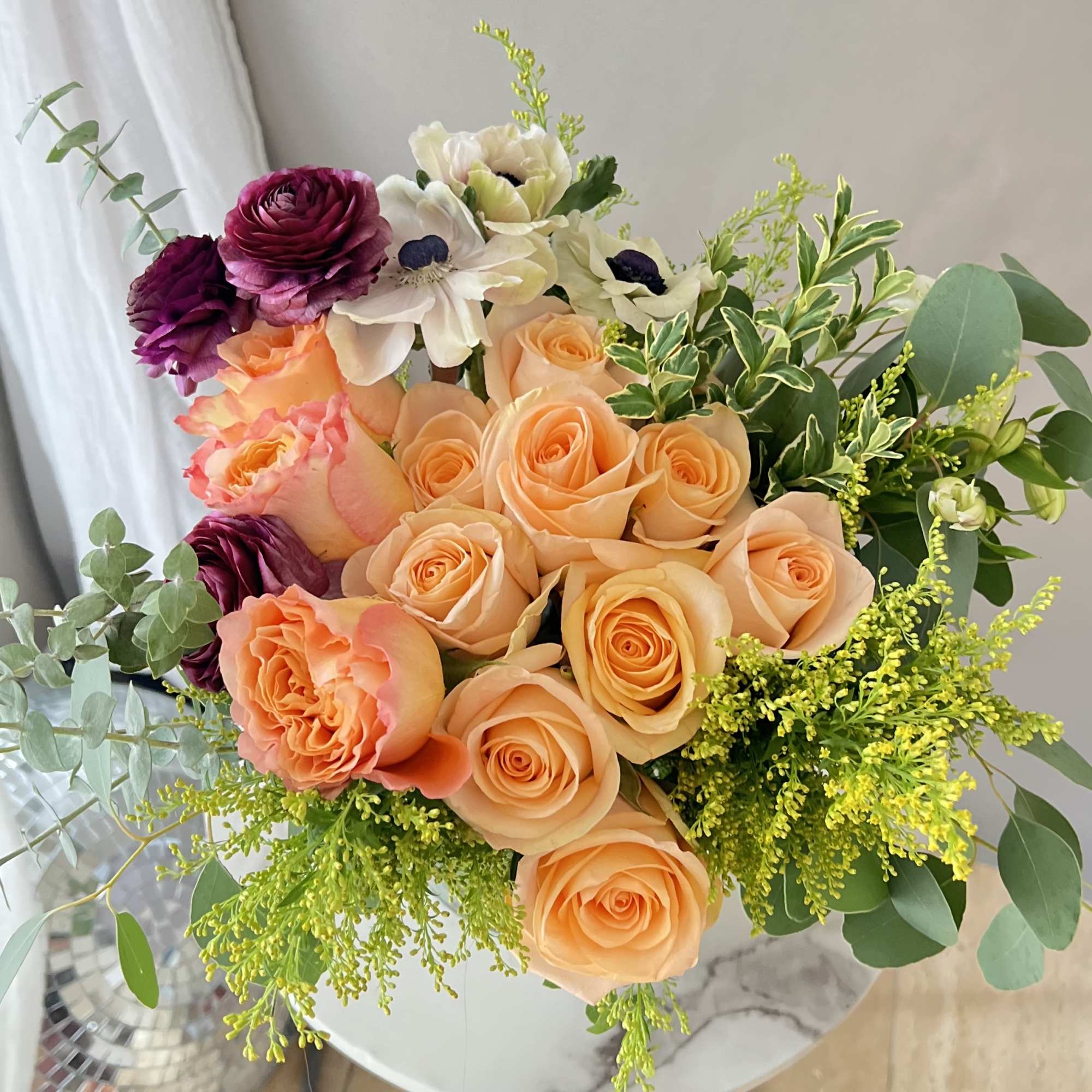 Bouquet of peach and purple roses with white flowers and greenery, photo 2 of 2