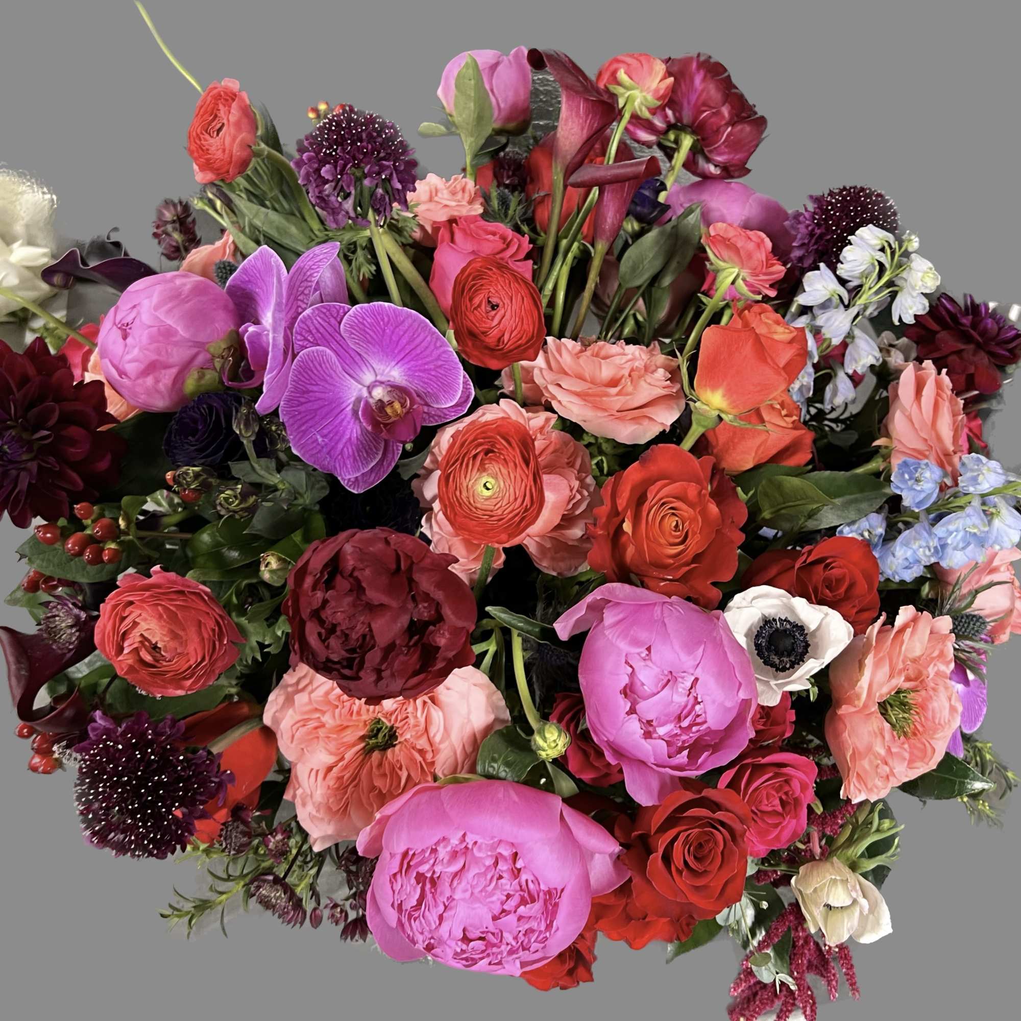 Mixed bouquet of pink, red, purple, and white flowers