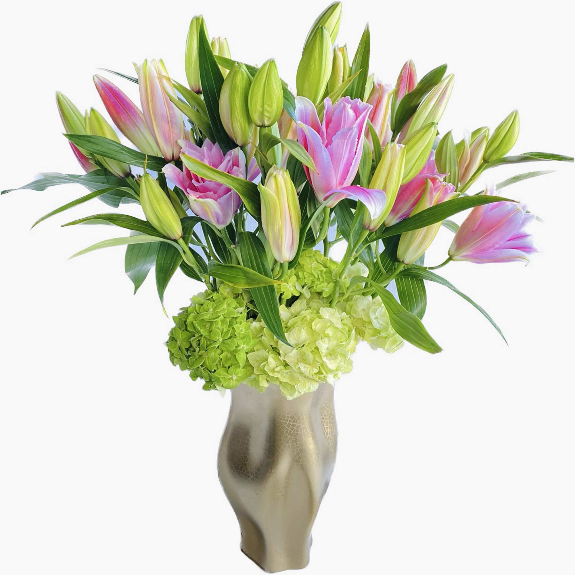 Pink and green lilies arranged in a tall metallic vase
