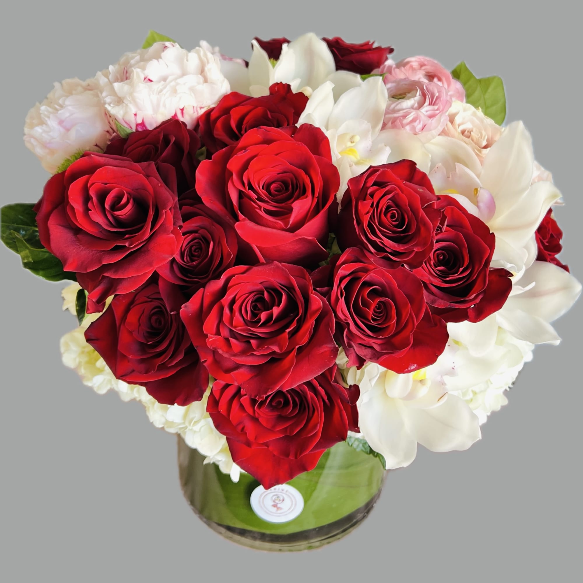 Bouquet of red and white roses in a glass vase