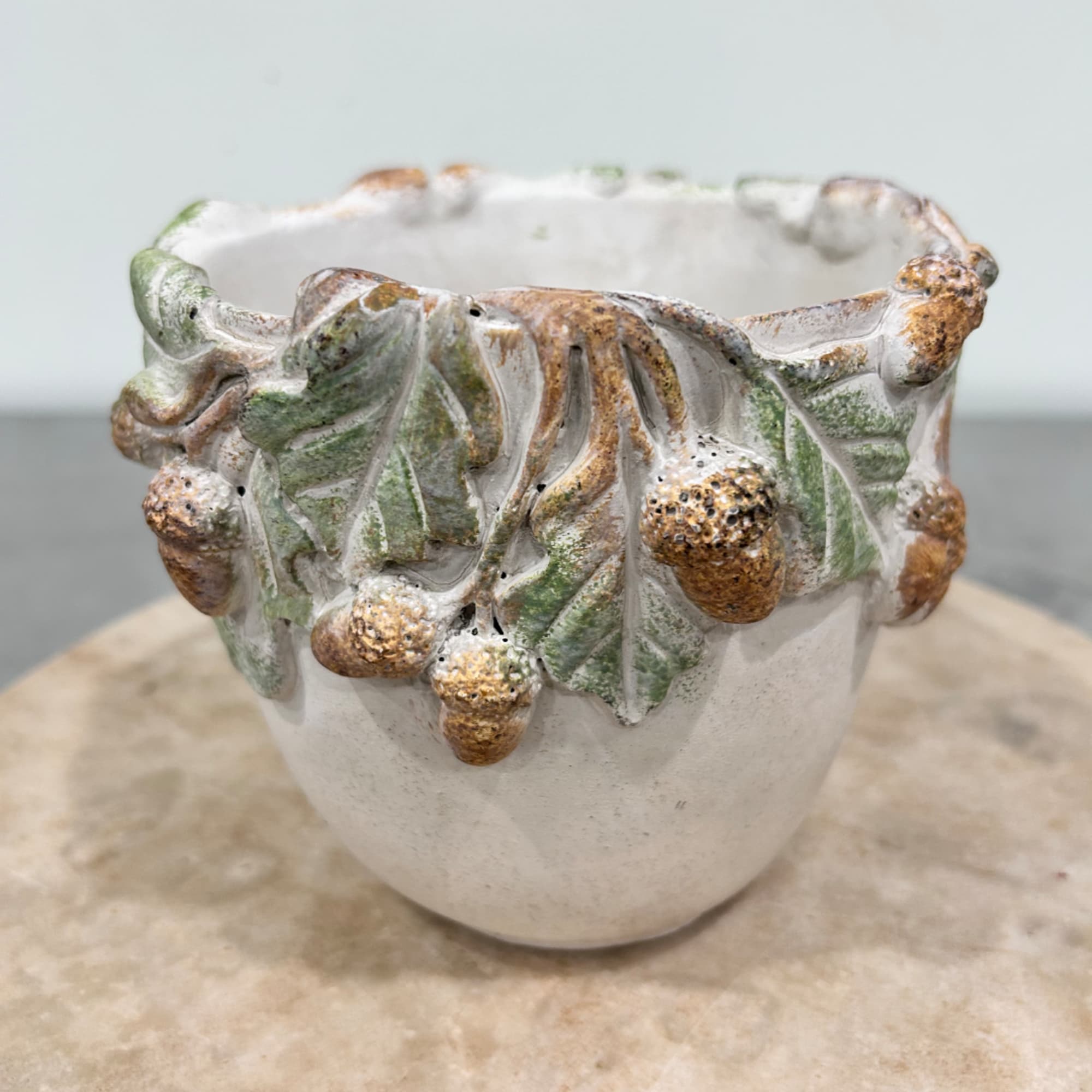 Ceramic pot with raised acorn and leaf decoration