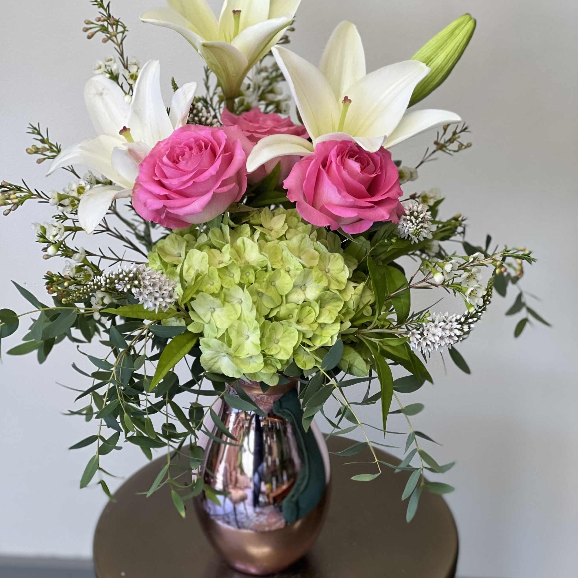 This beautiful arrangement has hydrangea, lily&rsquo;s and roses in a spectacular pink, photo 2 of 2