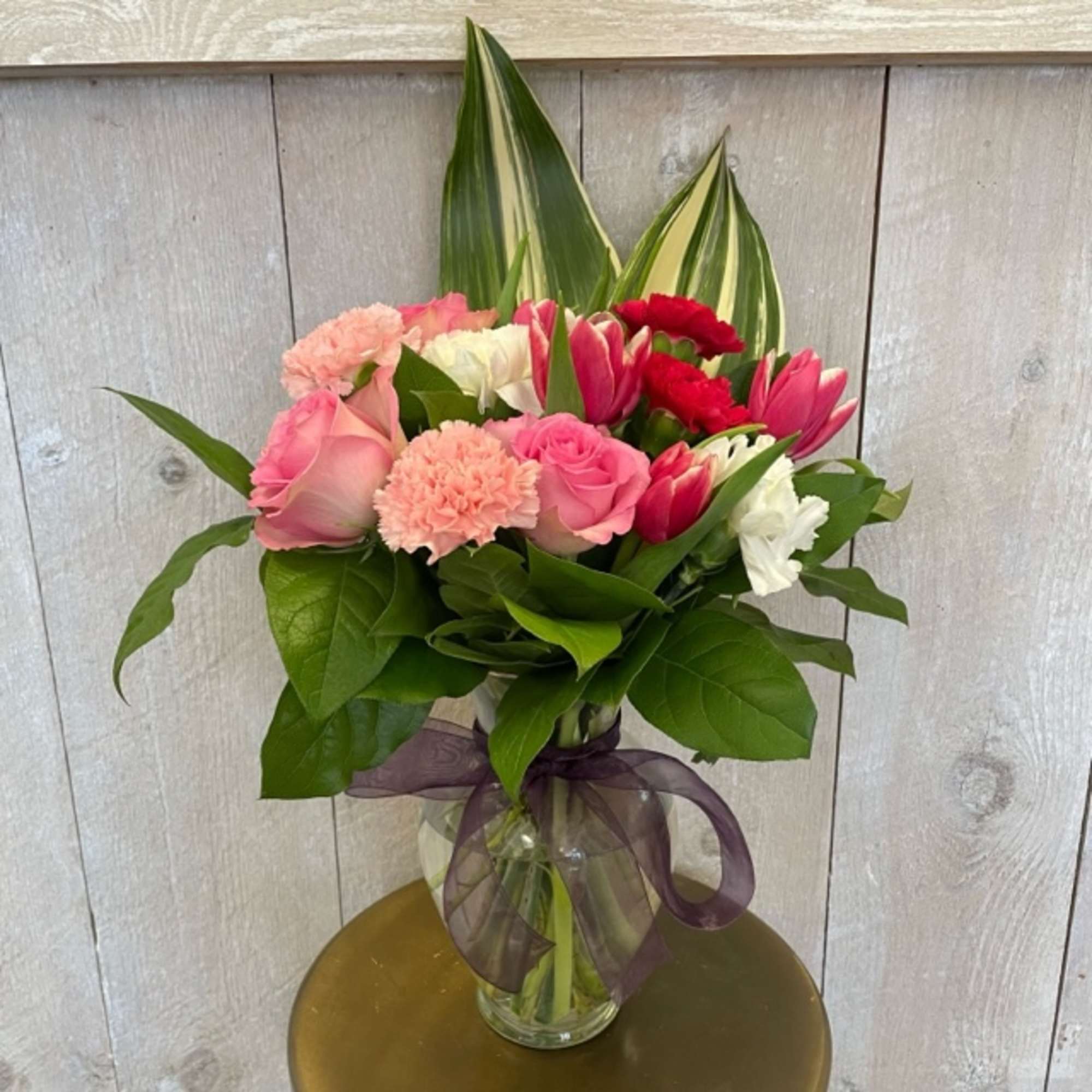 A sweet, simple, and springy Valentine's inspired arrangement for your sweet. Features