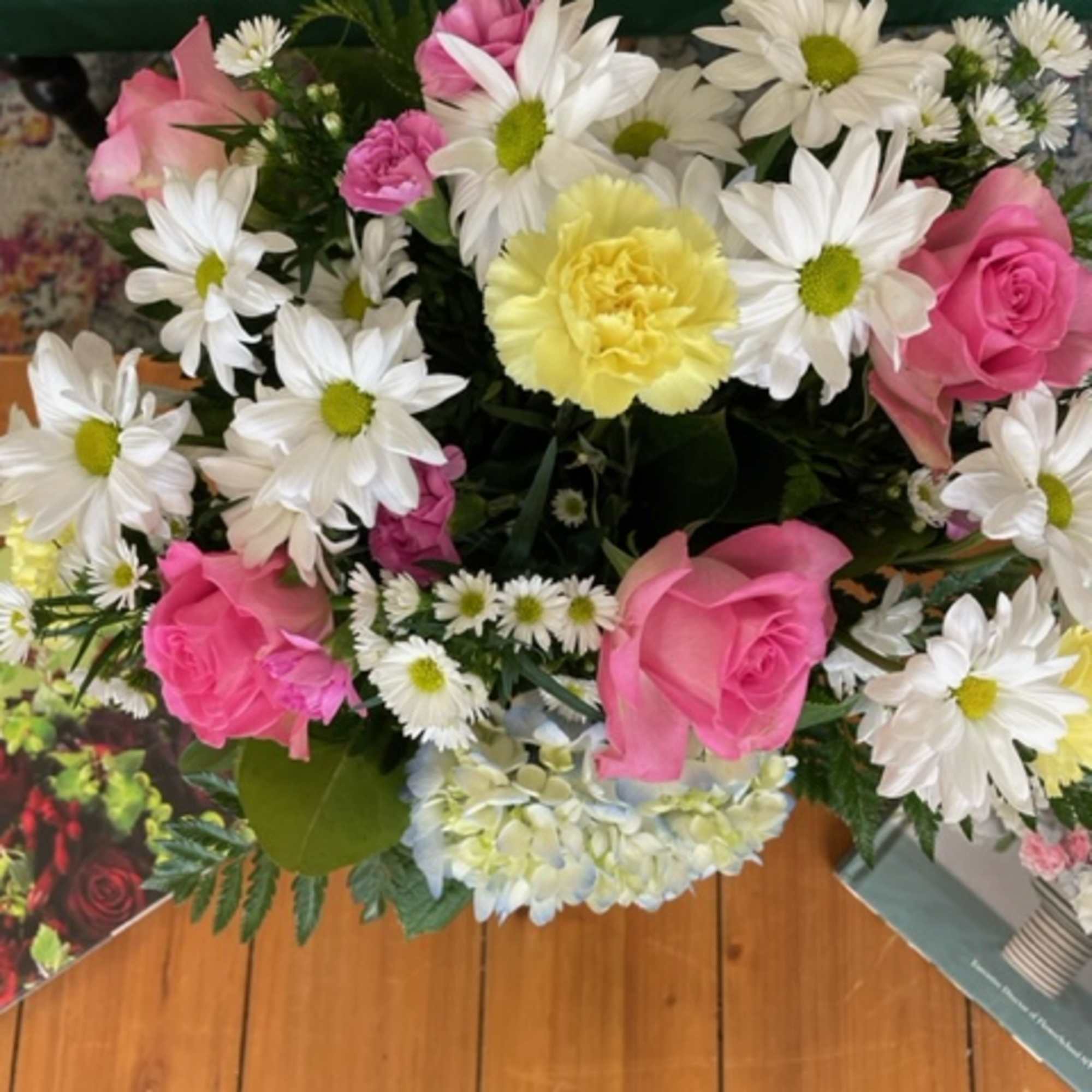 Pink roses and white daisies with a yellow carnation bouquet