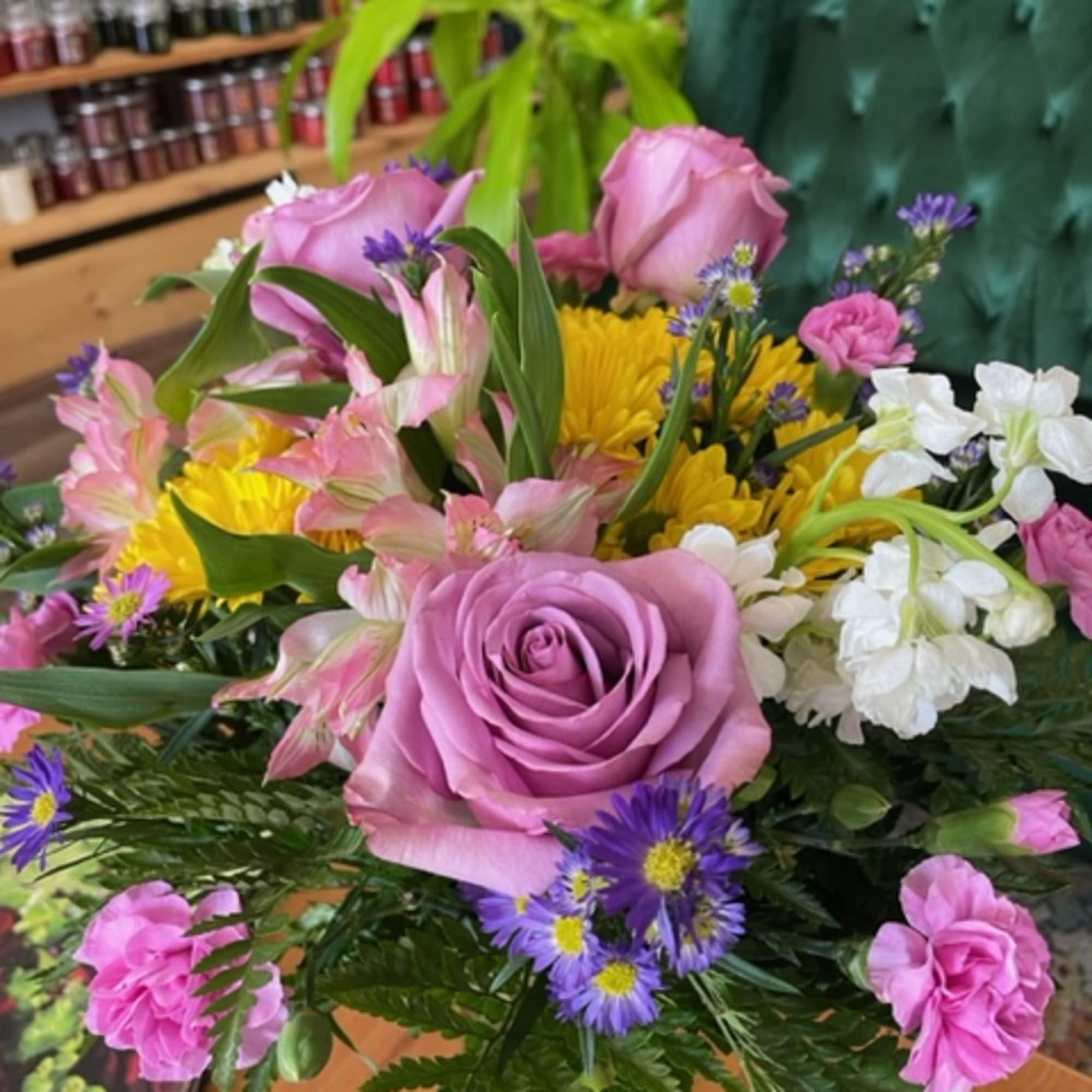 A lavender-themed arrangement featuring roses, daisies, alstroemerias, stock, mini carnations, and asters., photo 3 of 3