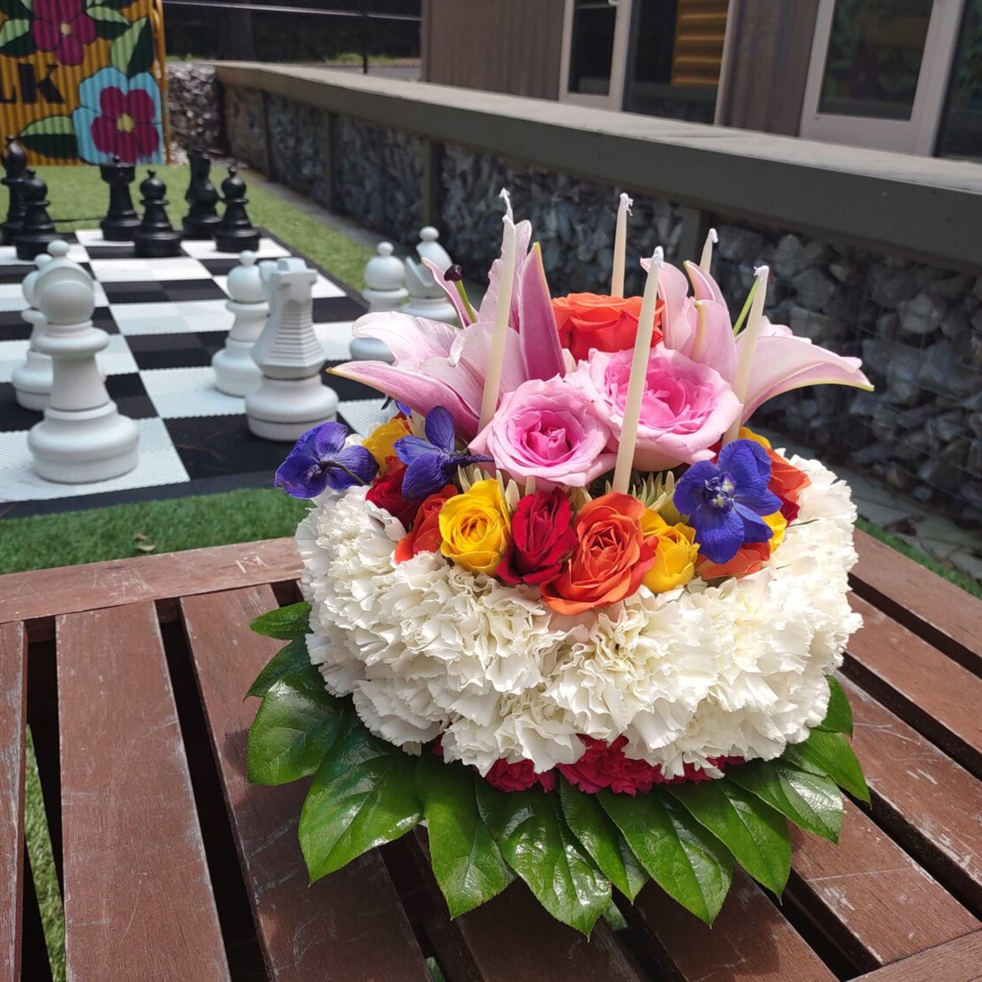 Colorful floral arrangement with roses and lilies on a table