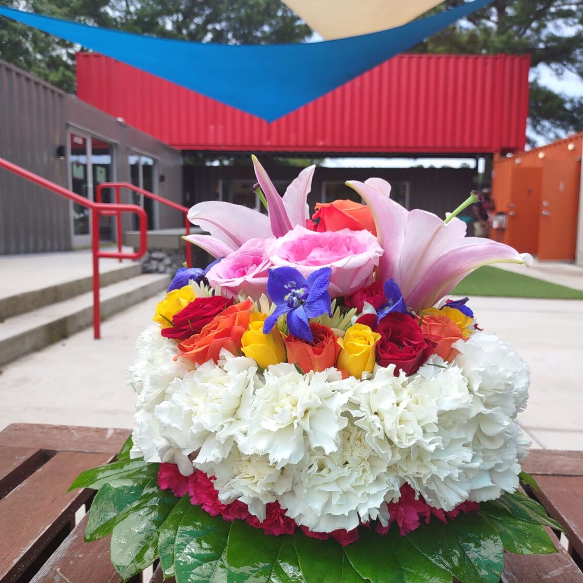 Colorful mixed bouquet with lilies, roses, and carnations
