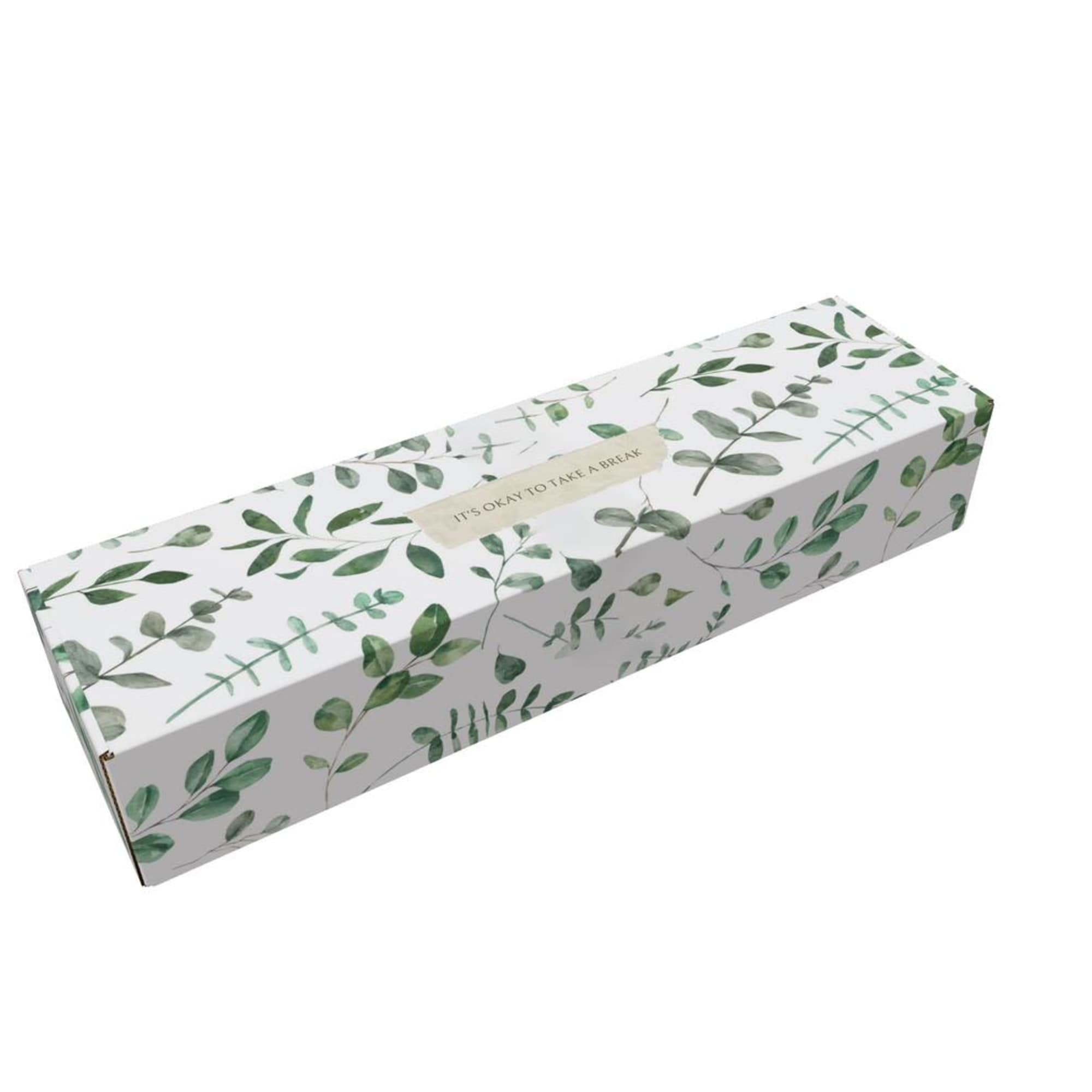 Leaf-patterned rectangular gift box with a small label on top