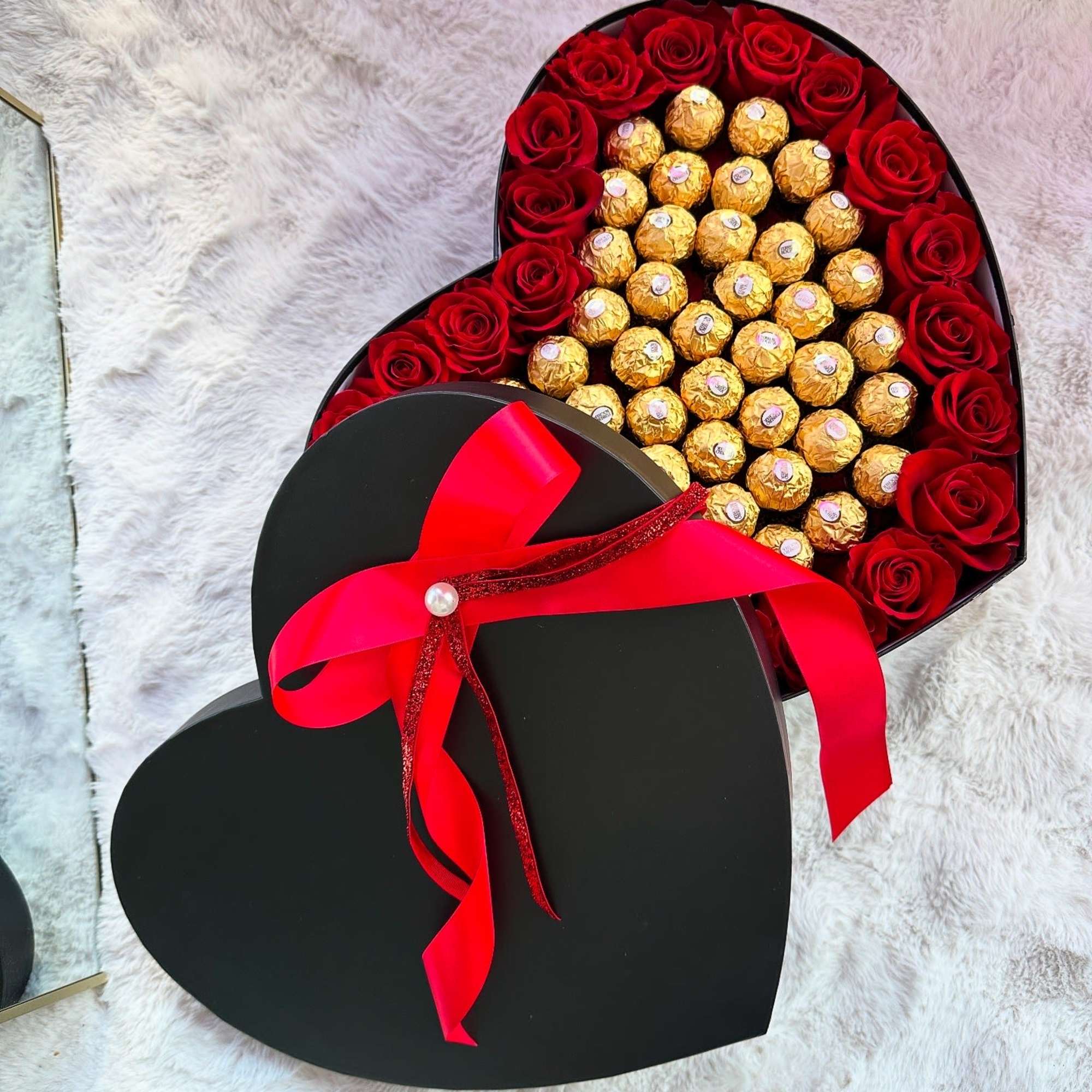 Beautiful combination of red roses and golden Ferrero Rocher chocolates in a