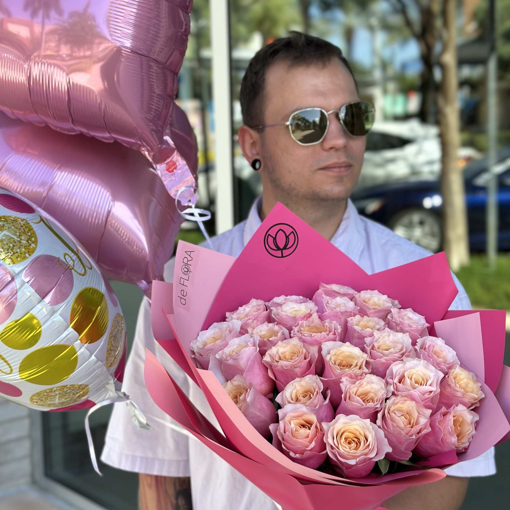 Pink rose bouquet with heart-shaped balloons