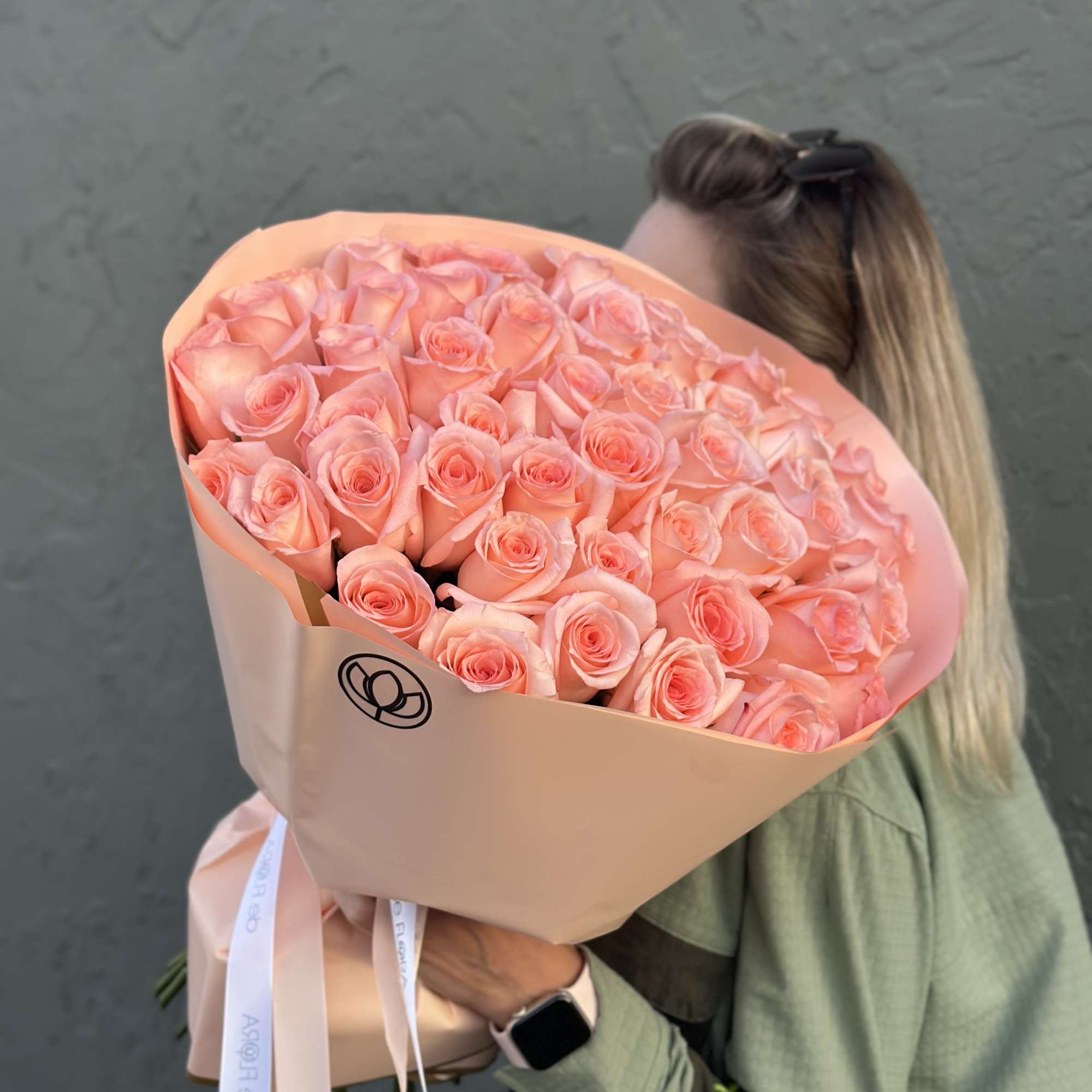 Large bouquet of peach-pink roses wrapped in blush paper, photo 2 of 4