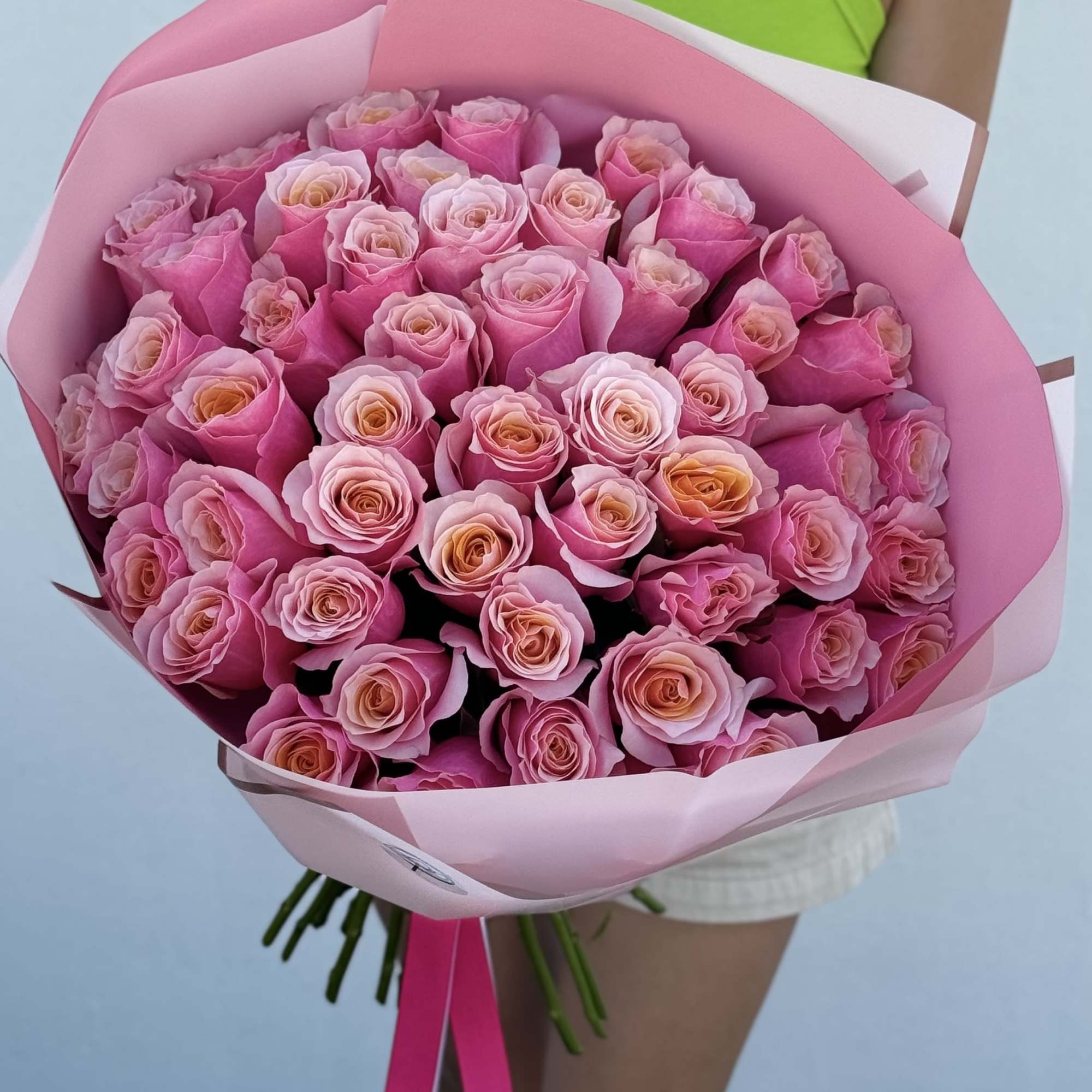 Large bouquet of pink roses wrapped in pink paper, photo 3 of 3