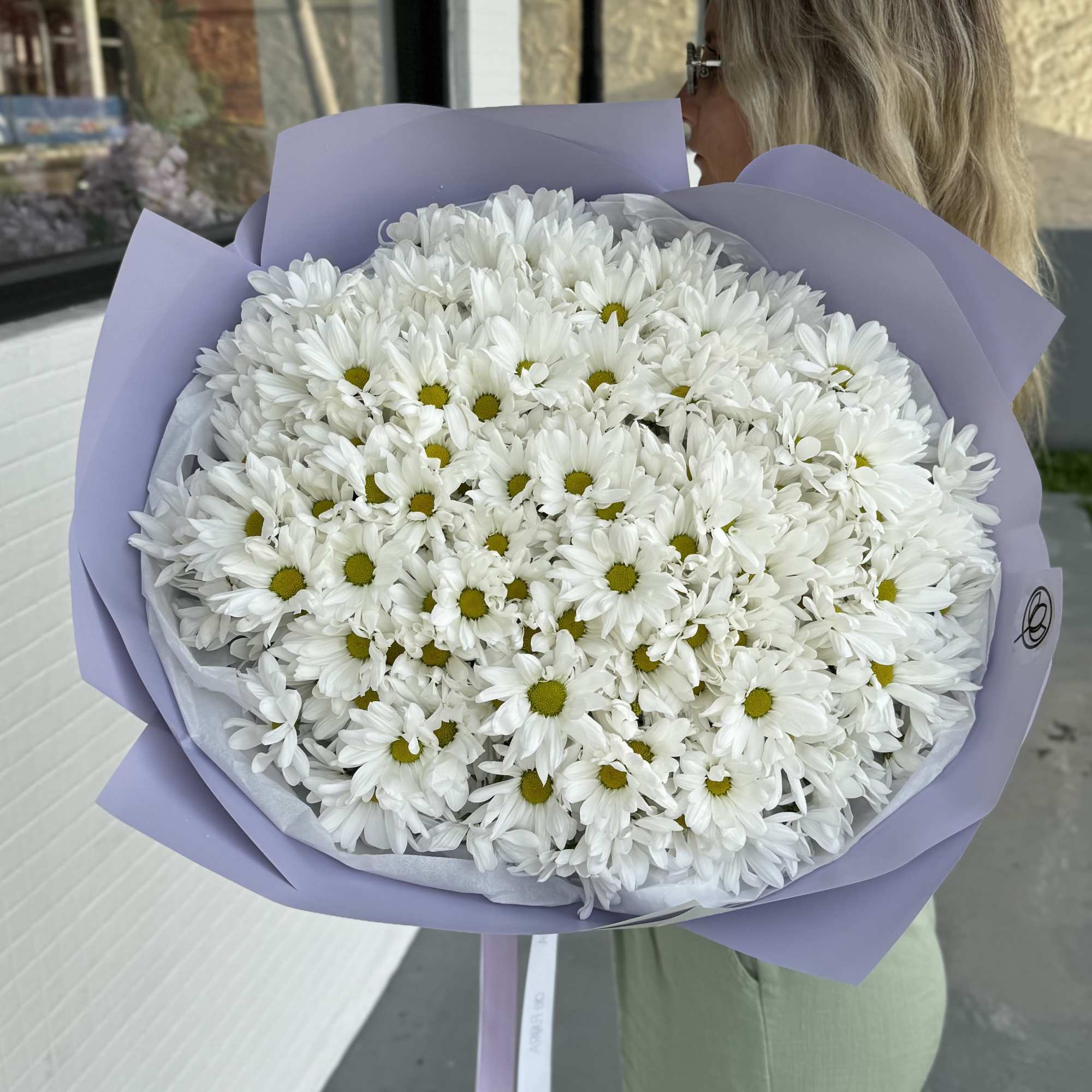 Large bouquet of white daisies wrapped in lavender paper, photo 3 of 5