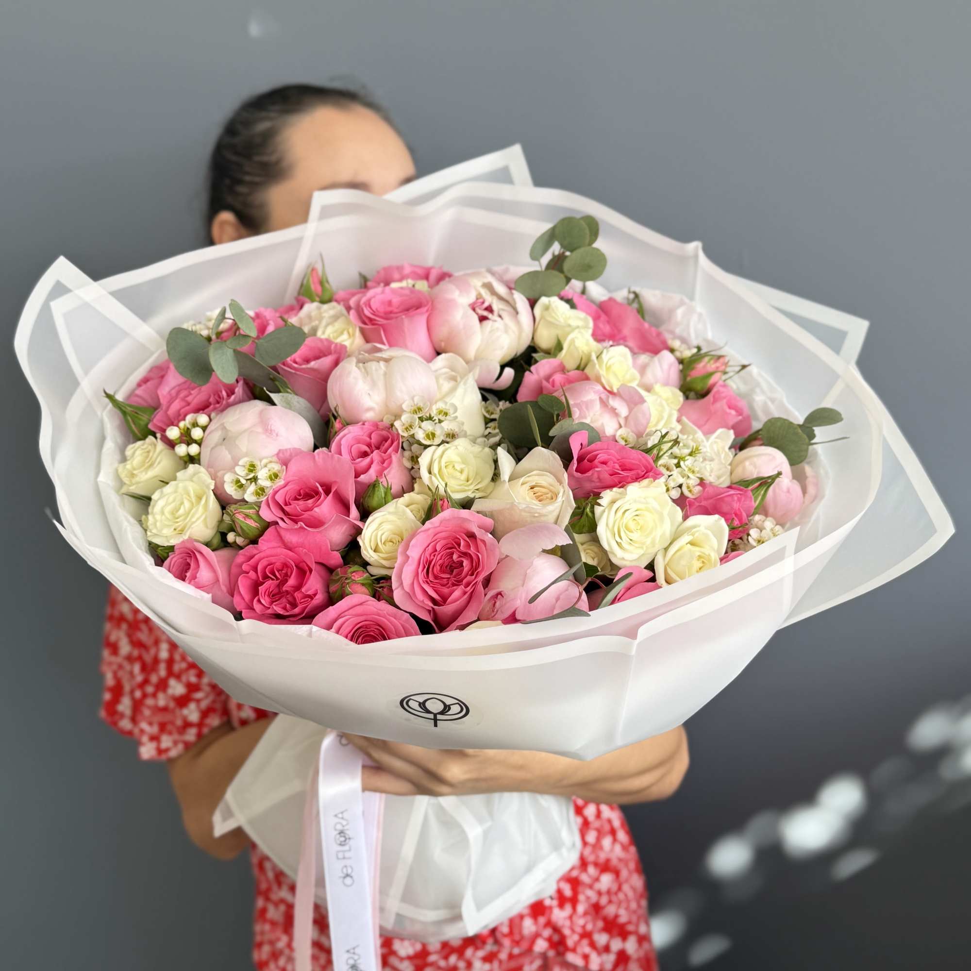 Large bouquet of pink and white roses wrapped in white paper, photo 3 of 3