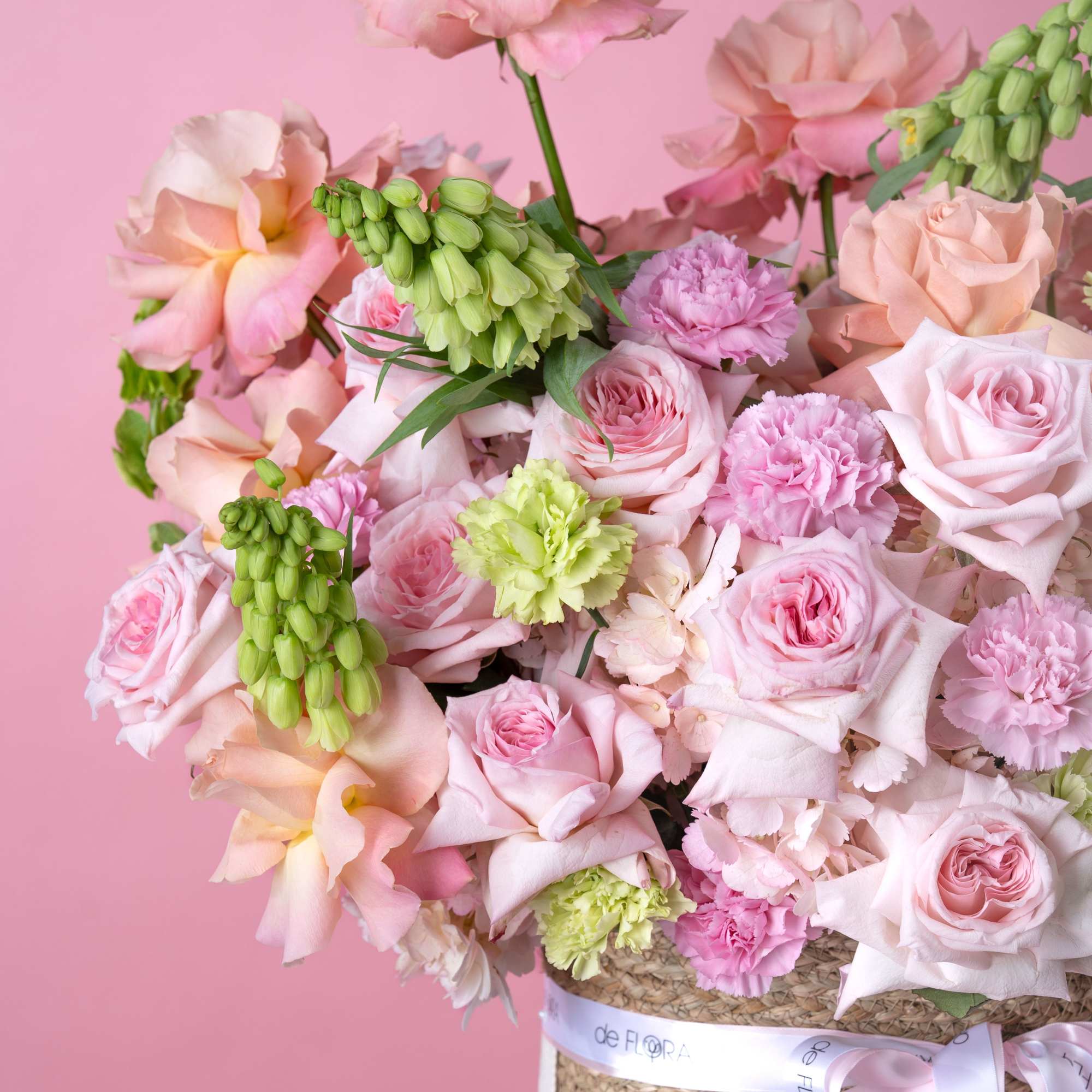 Soft blush and peach roses mingle with ruffled pink carnations in a, photo 3 of 4