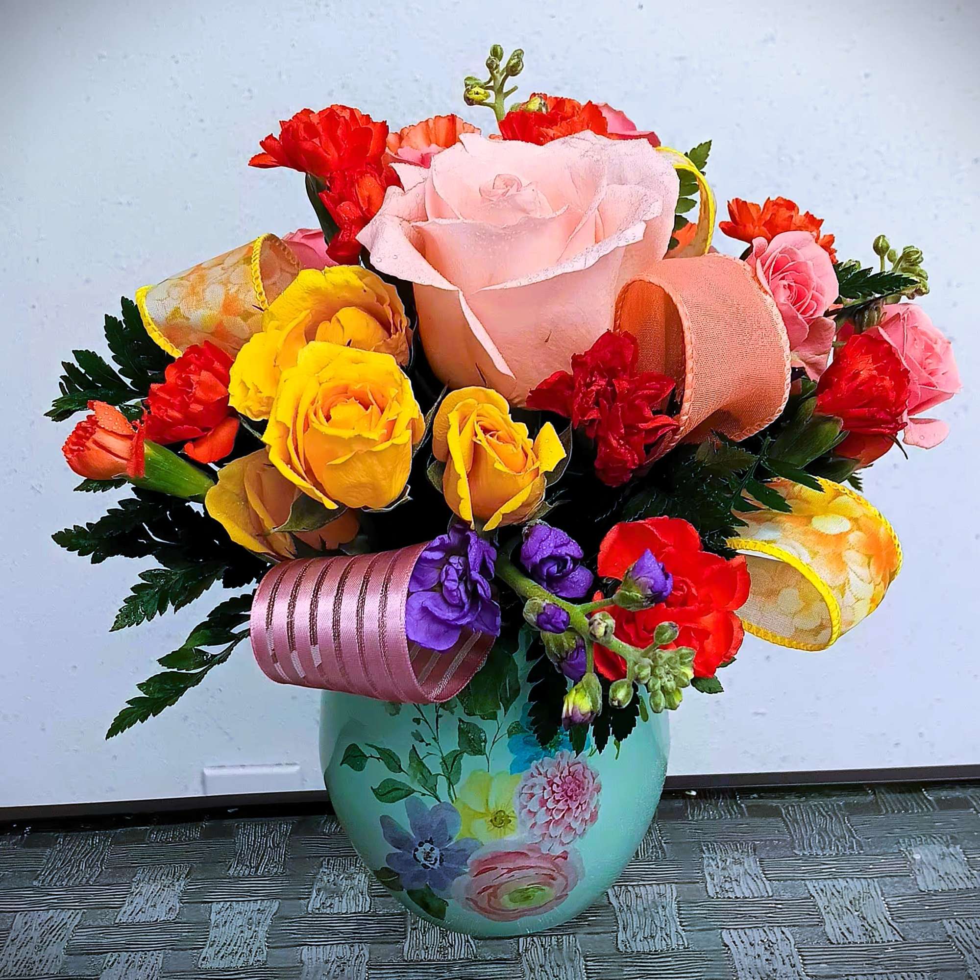 This cute fresh floral arrangement in keepsake container is great for many