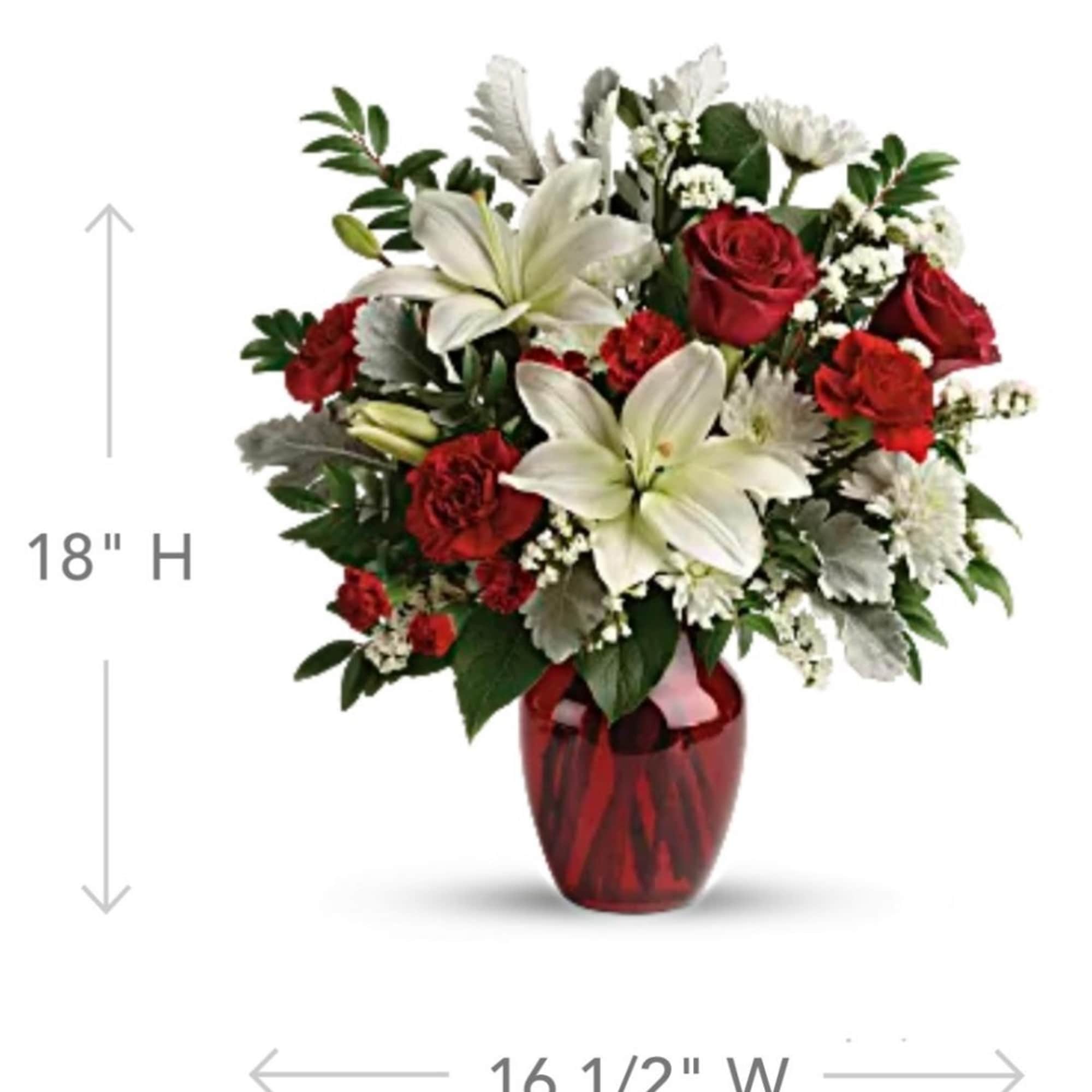 Red roses and white lilies in a red glass vase, photo 2 of 5