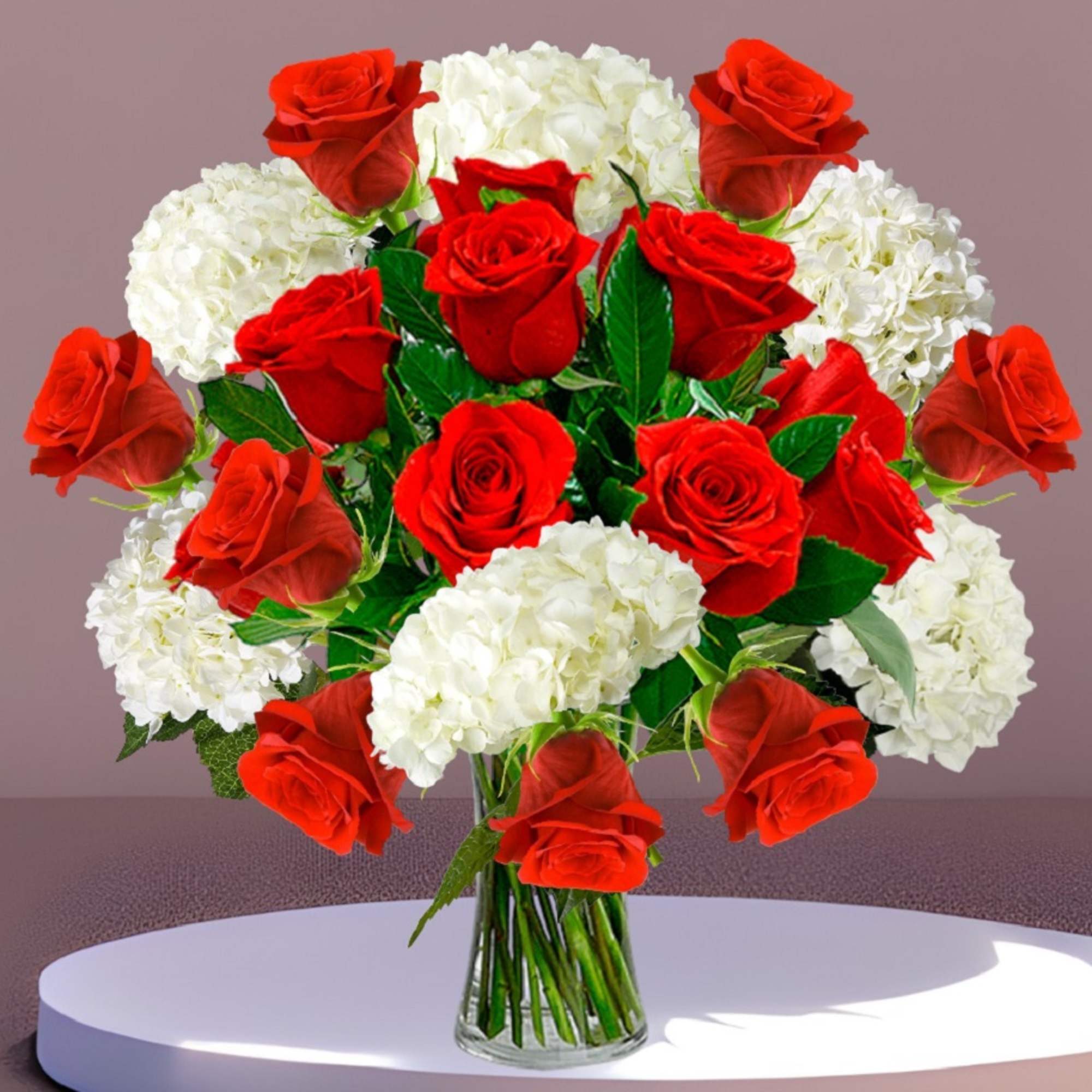 Red roses and white hydrangeas in a clear glass vase, photo 2 of 4
