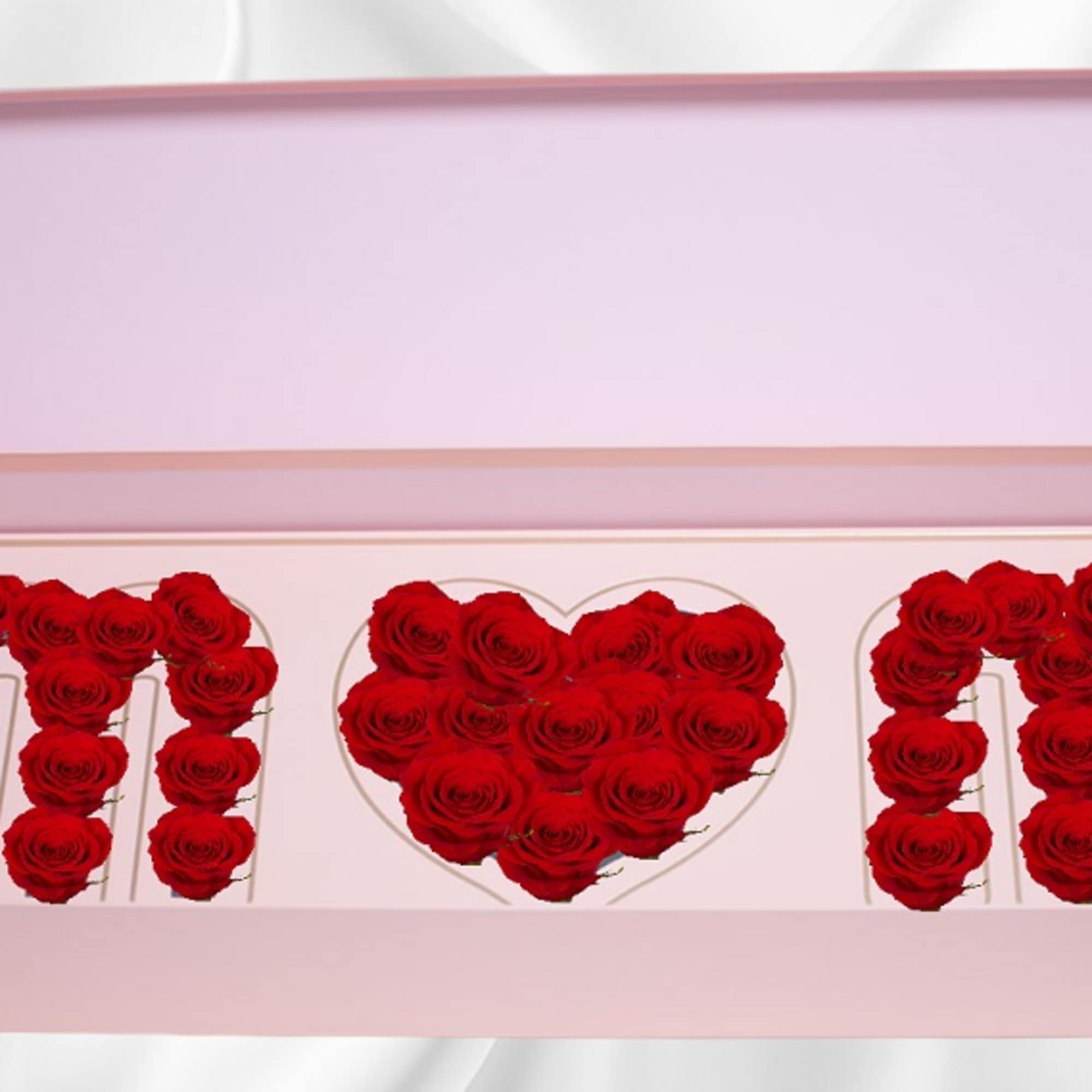 Pink gift box with red roses arranged as letters and a heart