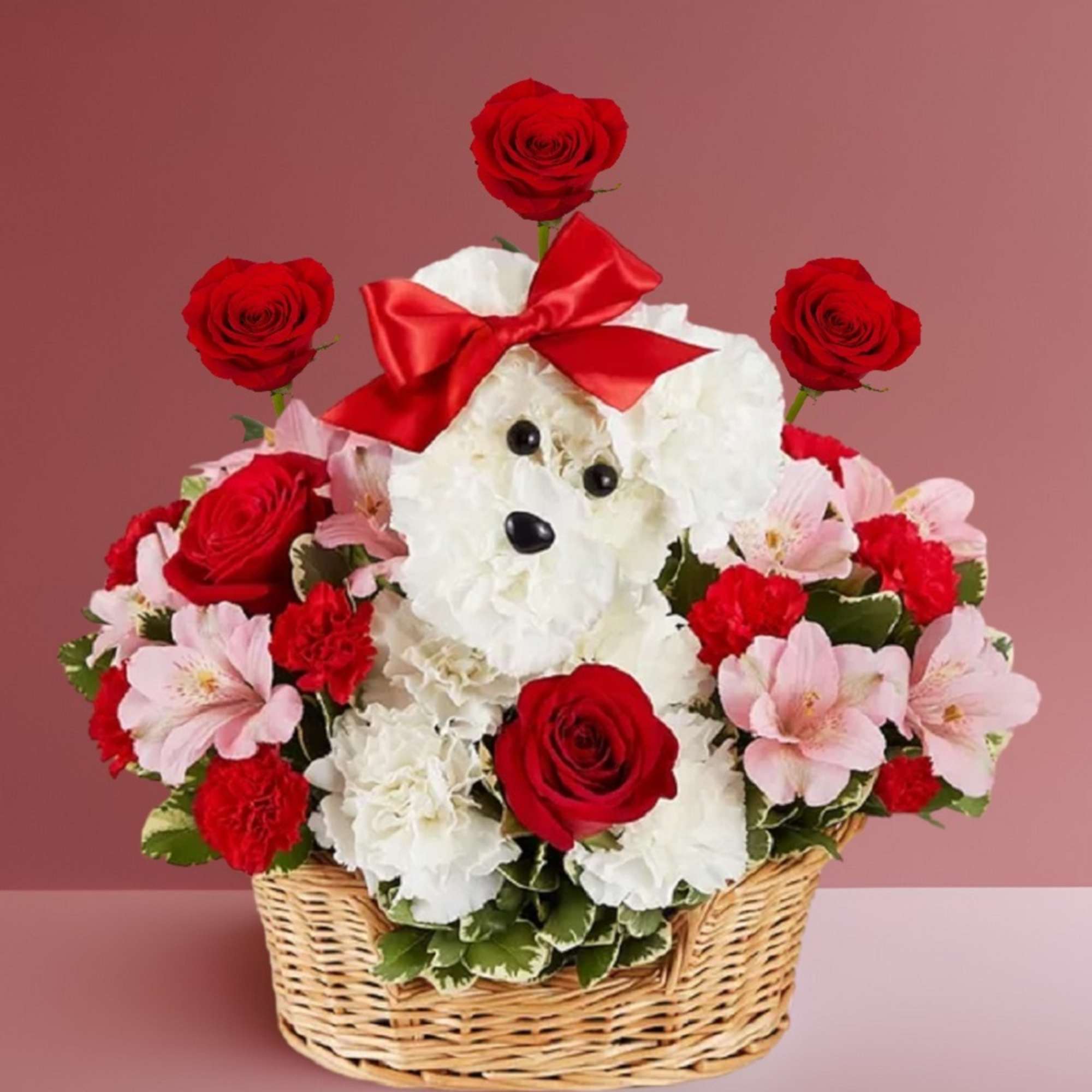 Flower basket with a teddy bear face, red roses, and pink blooms