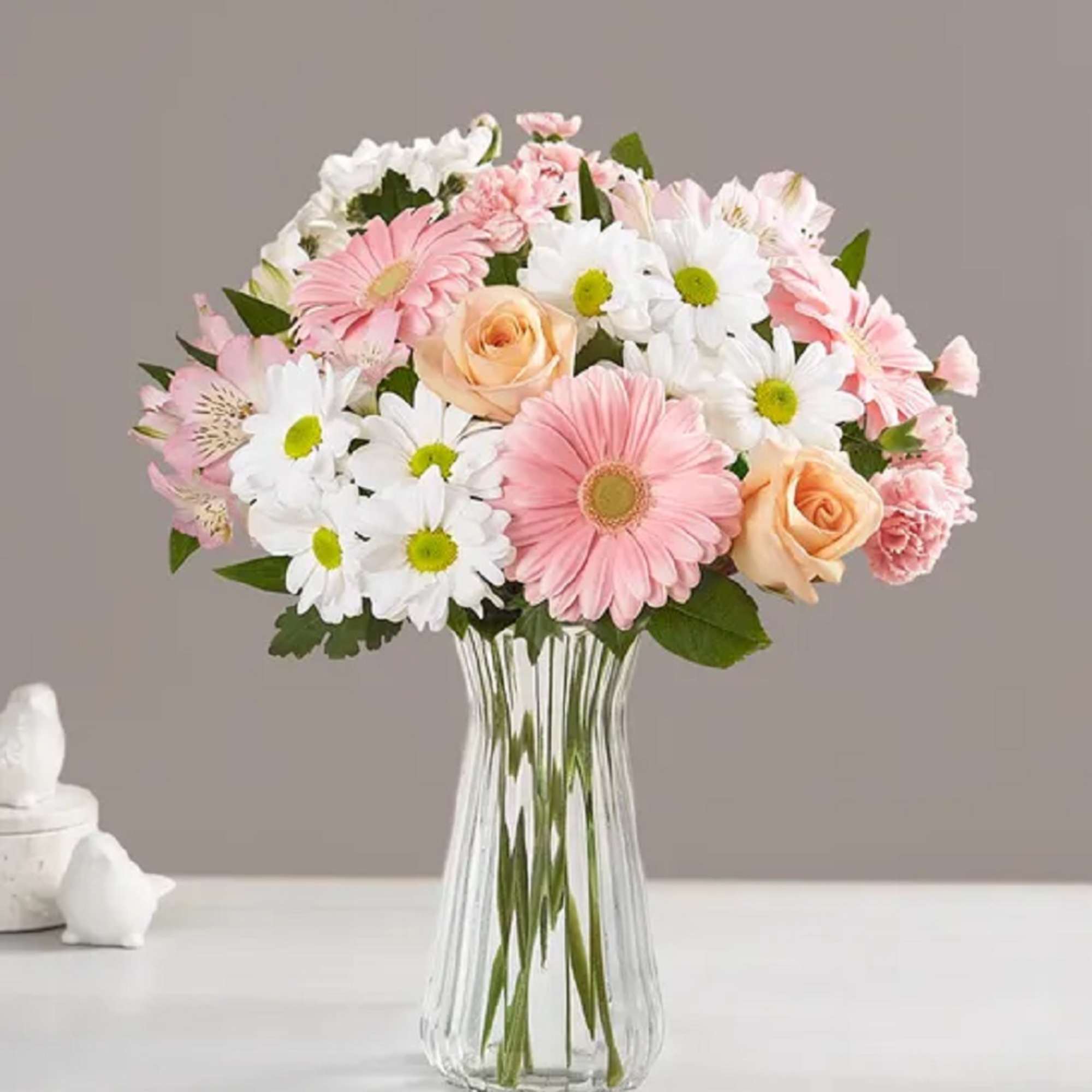 Pink and white mixed bouquet in a clear glass vase
