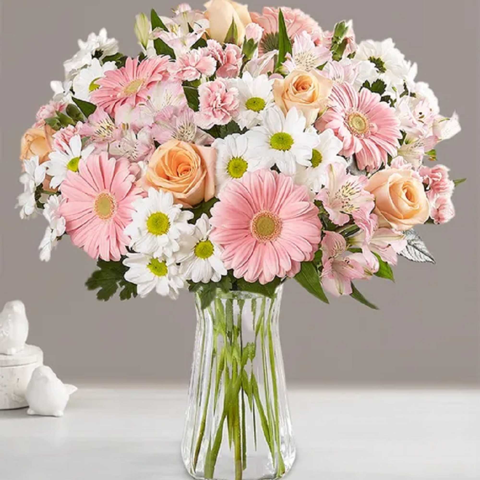 Pink and white mixed bouquet in a clear glass vase