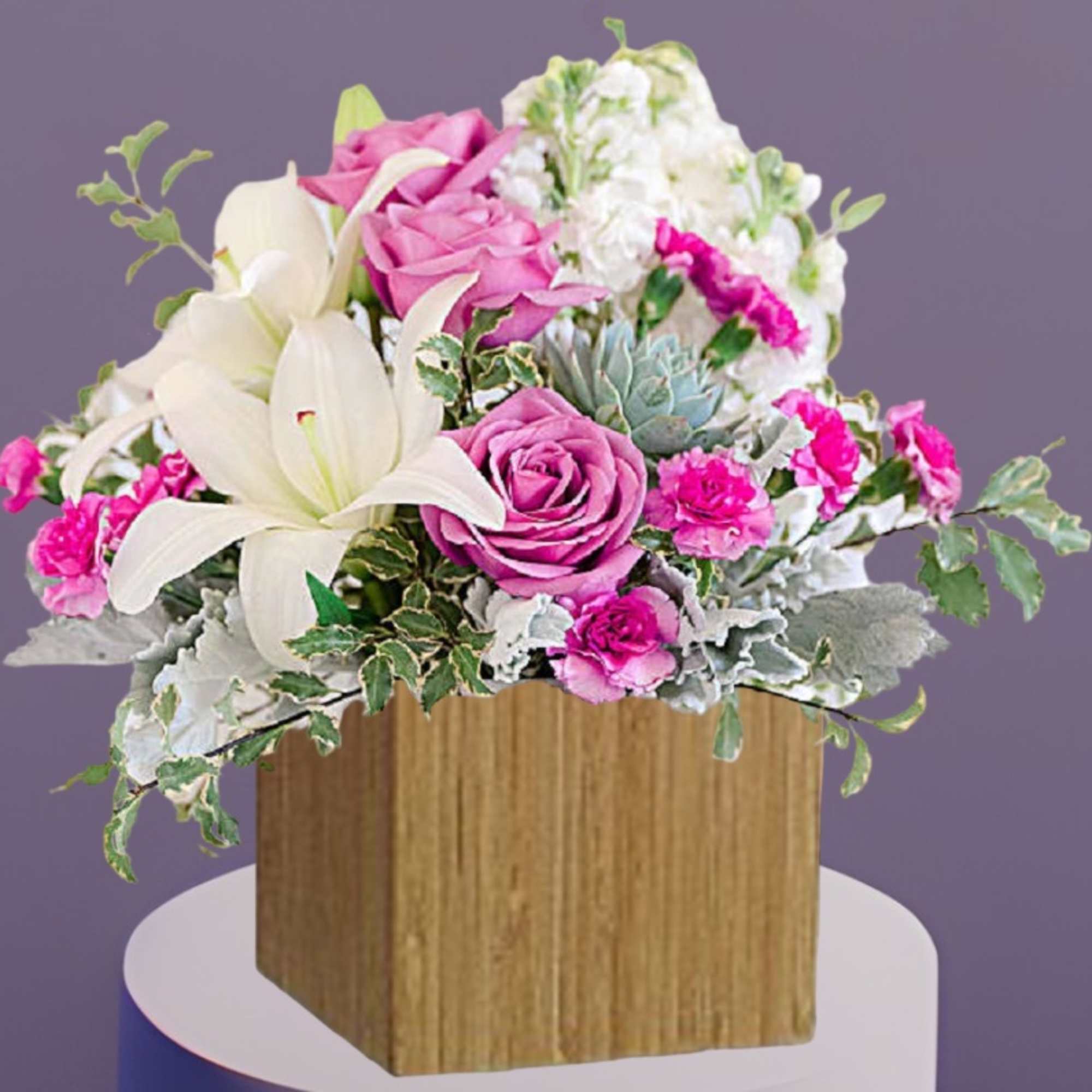 Pink roses and white lilies in a wooden box arrangement
