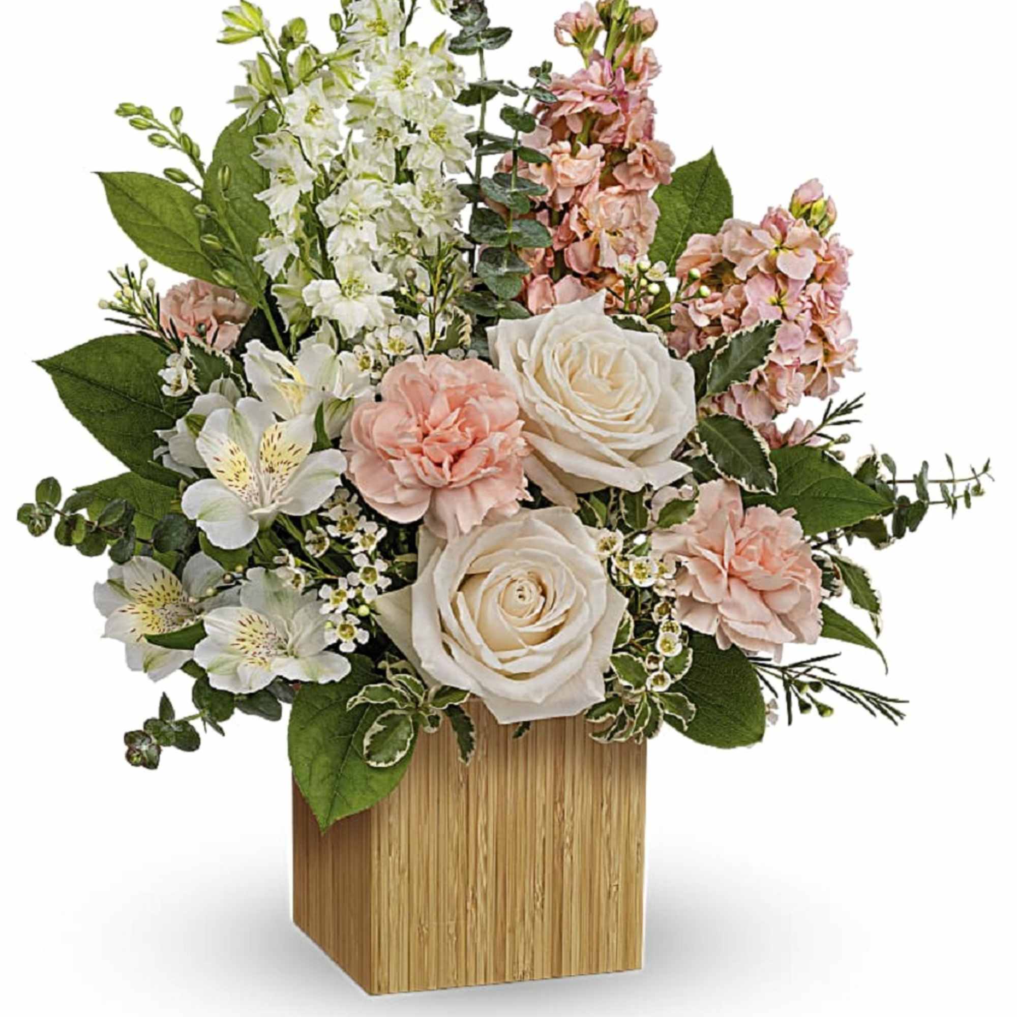 Pink and white floral arrangement in a wooden cube vase