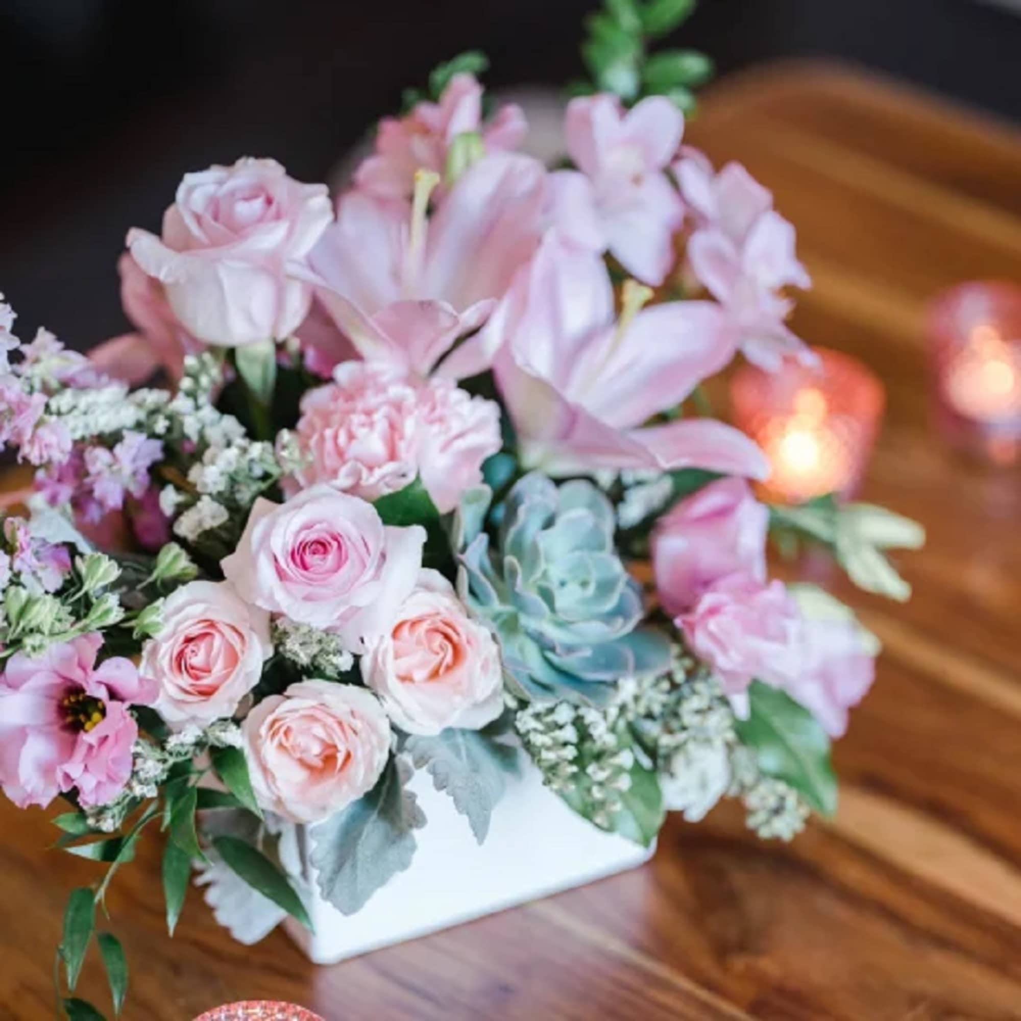 Pink roses and lilies arranged in a white rectangular vase, photo 9 of 10