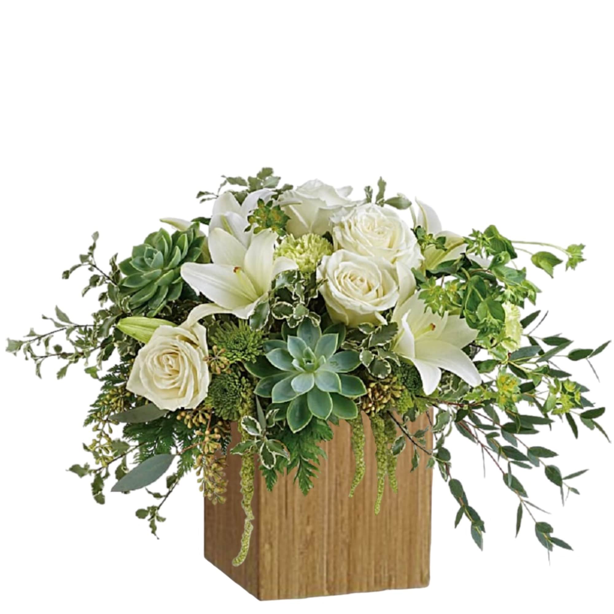 White roses and lilies in a wooden cube with trailing greenery