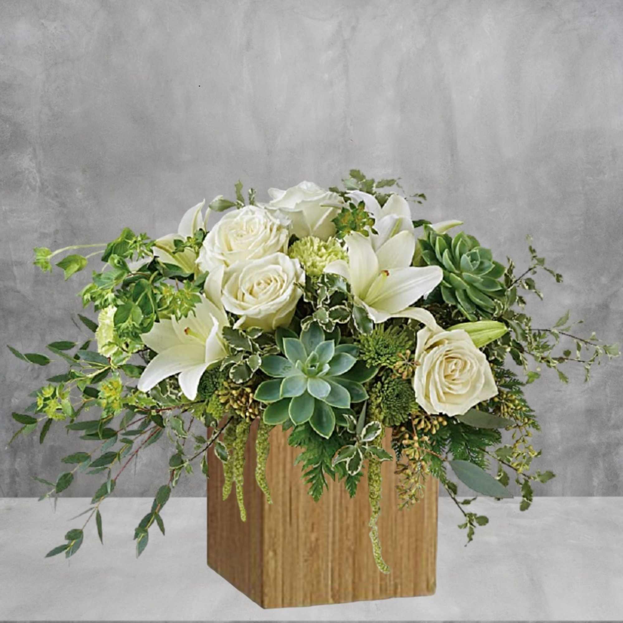 White roses and lilies arranged with succulents in a wooden box, photo 3 of 6