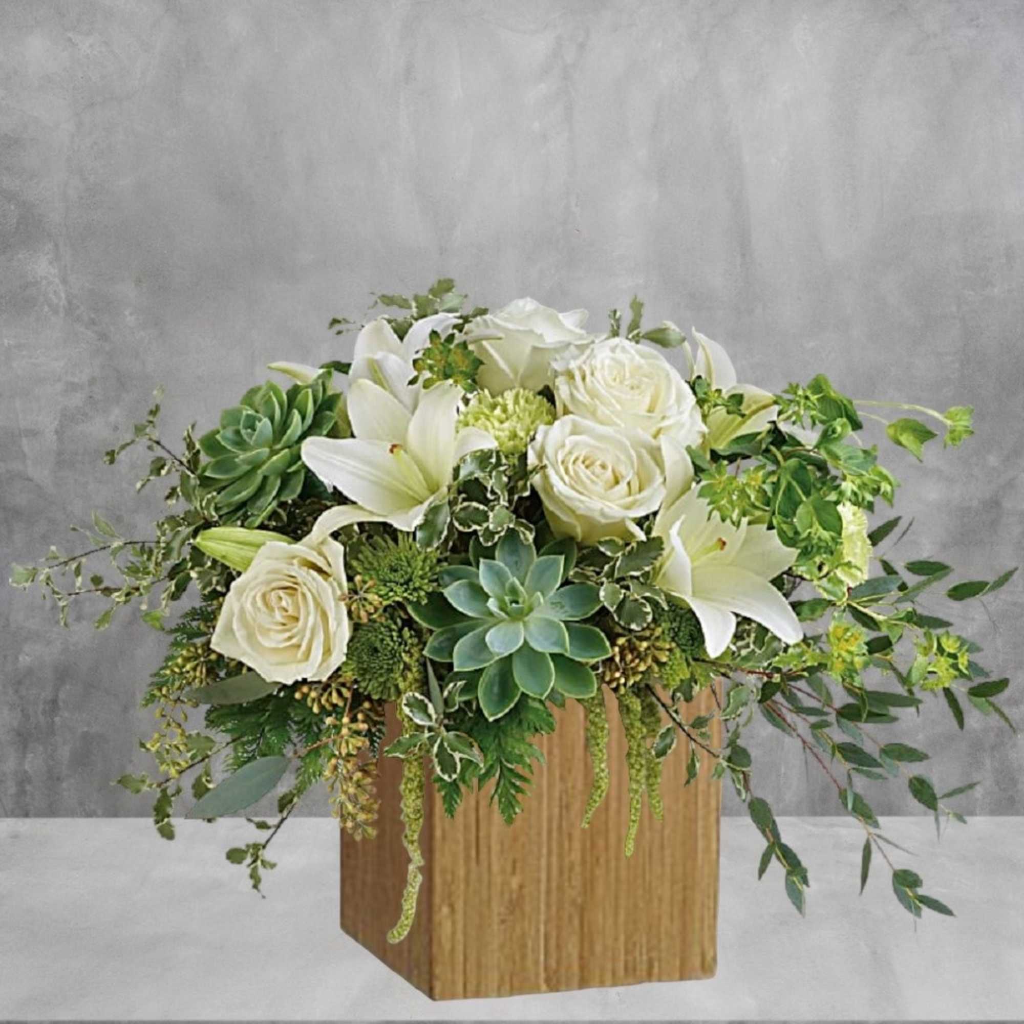 White roses and lilies in a wooden cube vase with succulents, photo 4 of 6