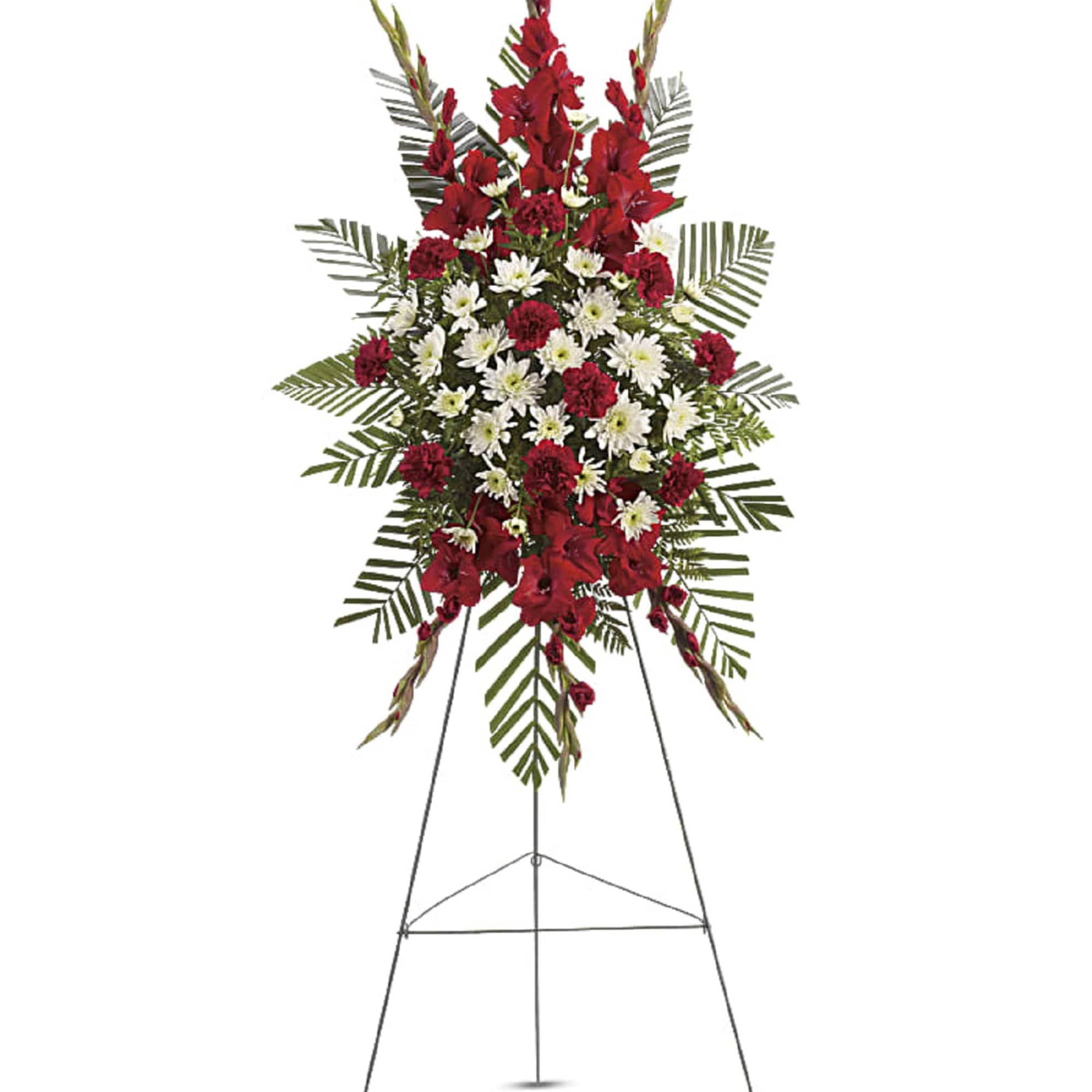 Standing funeral spray with red and white flowers on an easel
