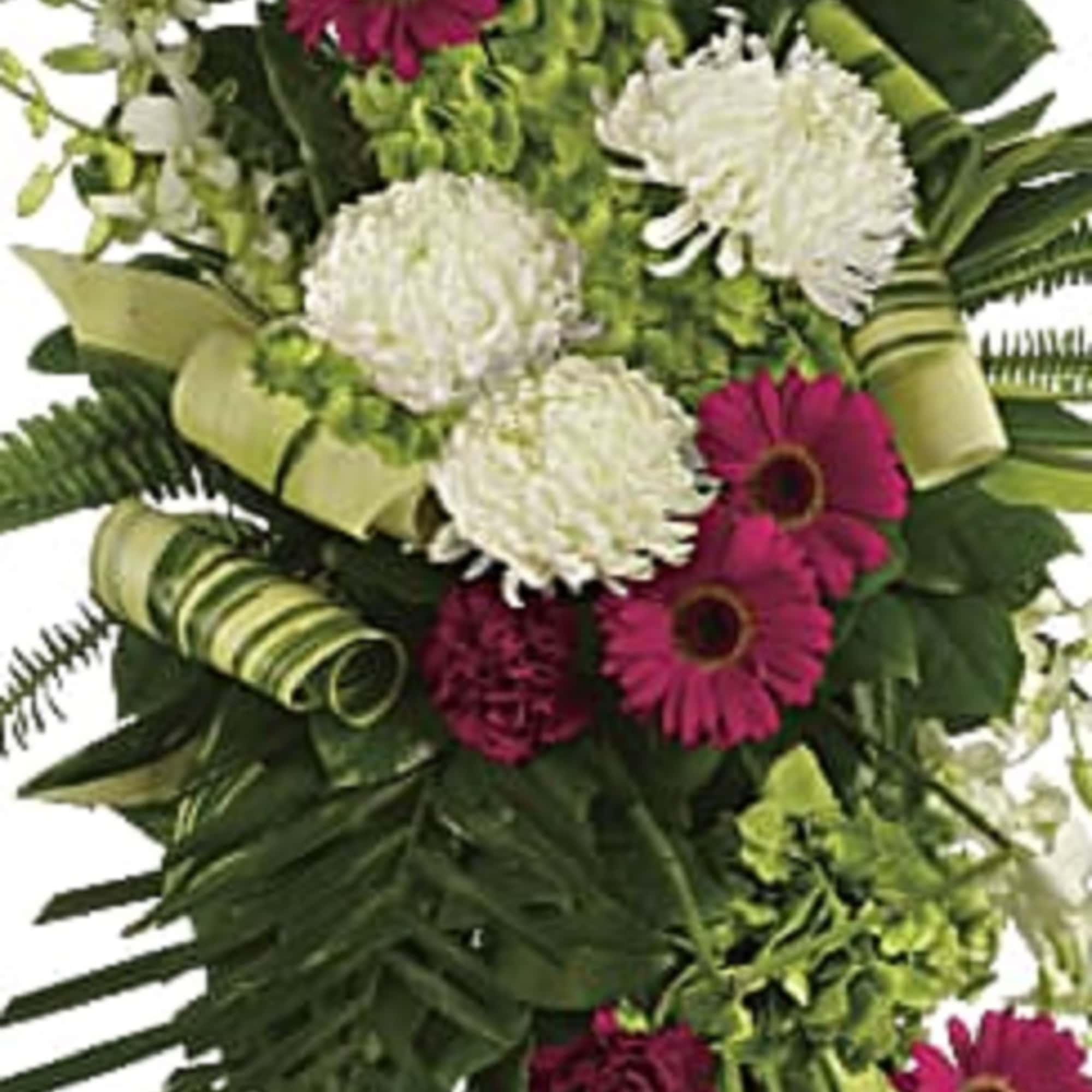 Tall bouquet of pink gerbera daisies and white chrysanthemums with palm leaves