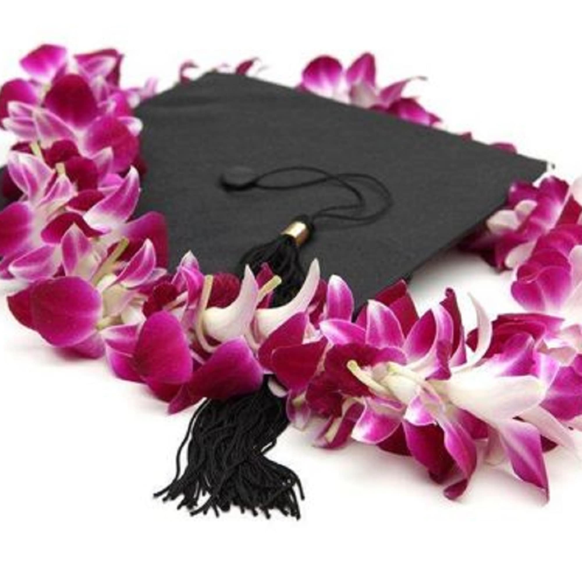 Graduation cap with a purple orchid lei