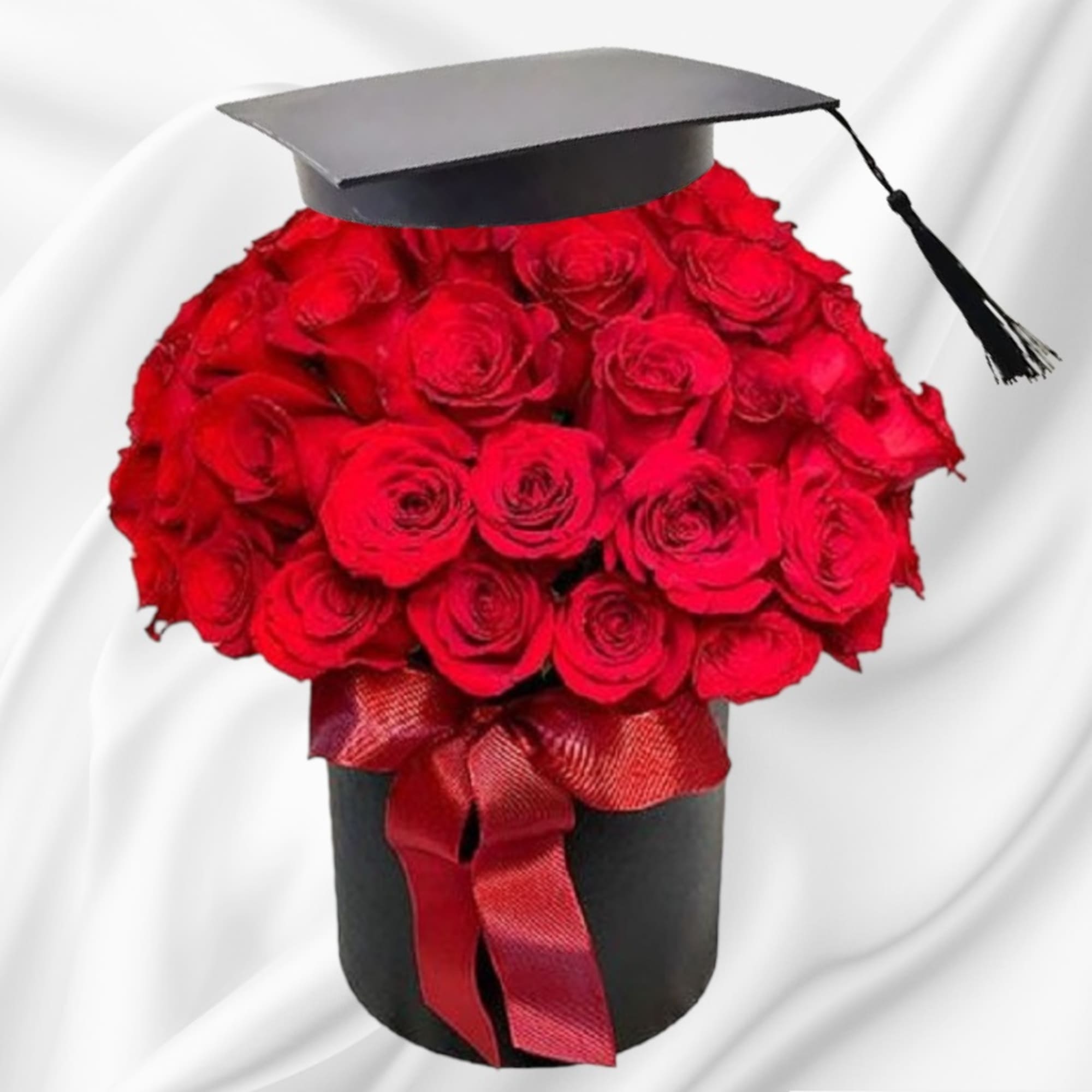 Red rose bouquet in a black hatbox with a graduation cap topper