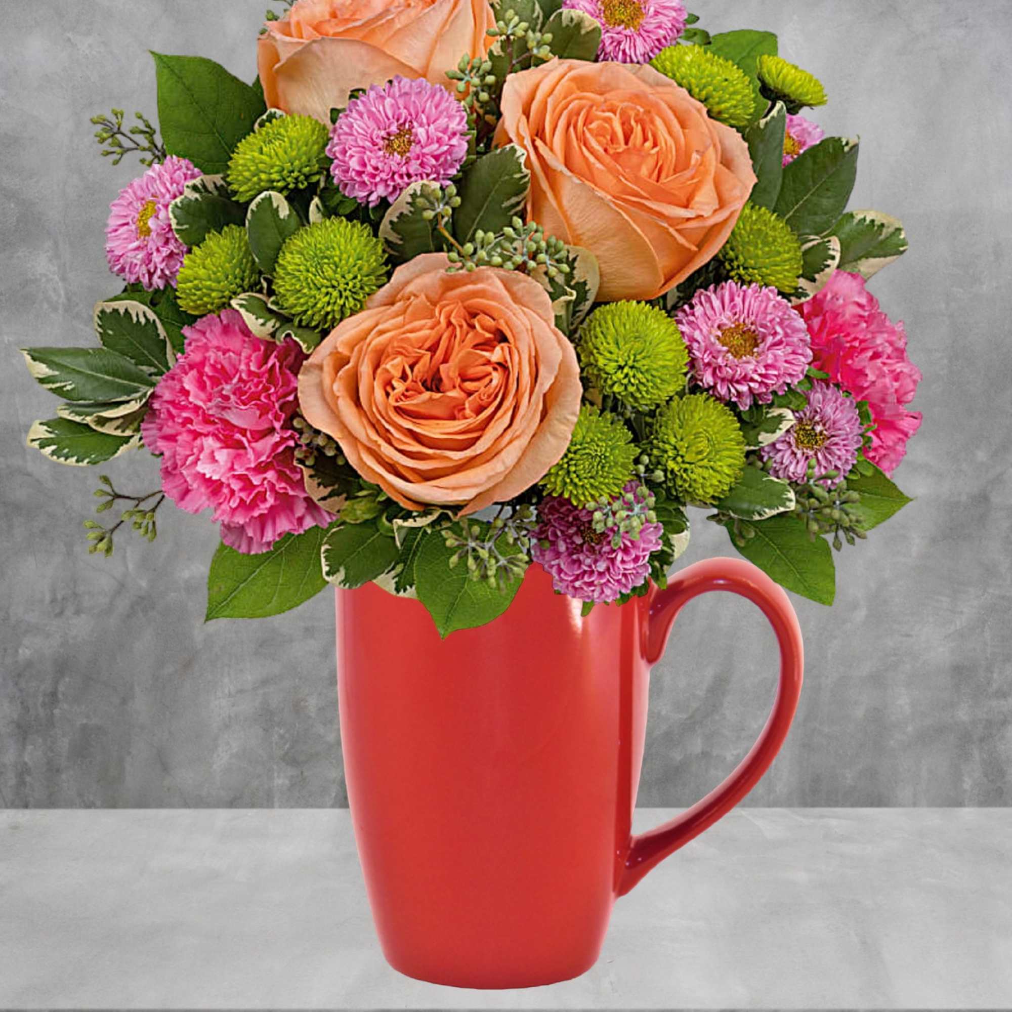 Peach roses and pink flowers arranged in a red mug, photo 3 of 4