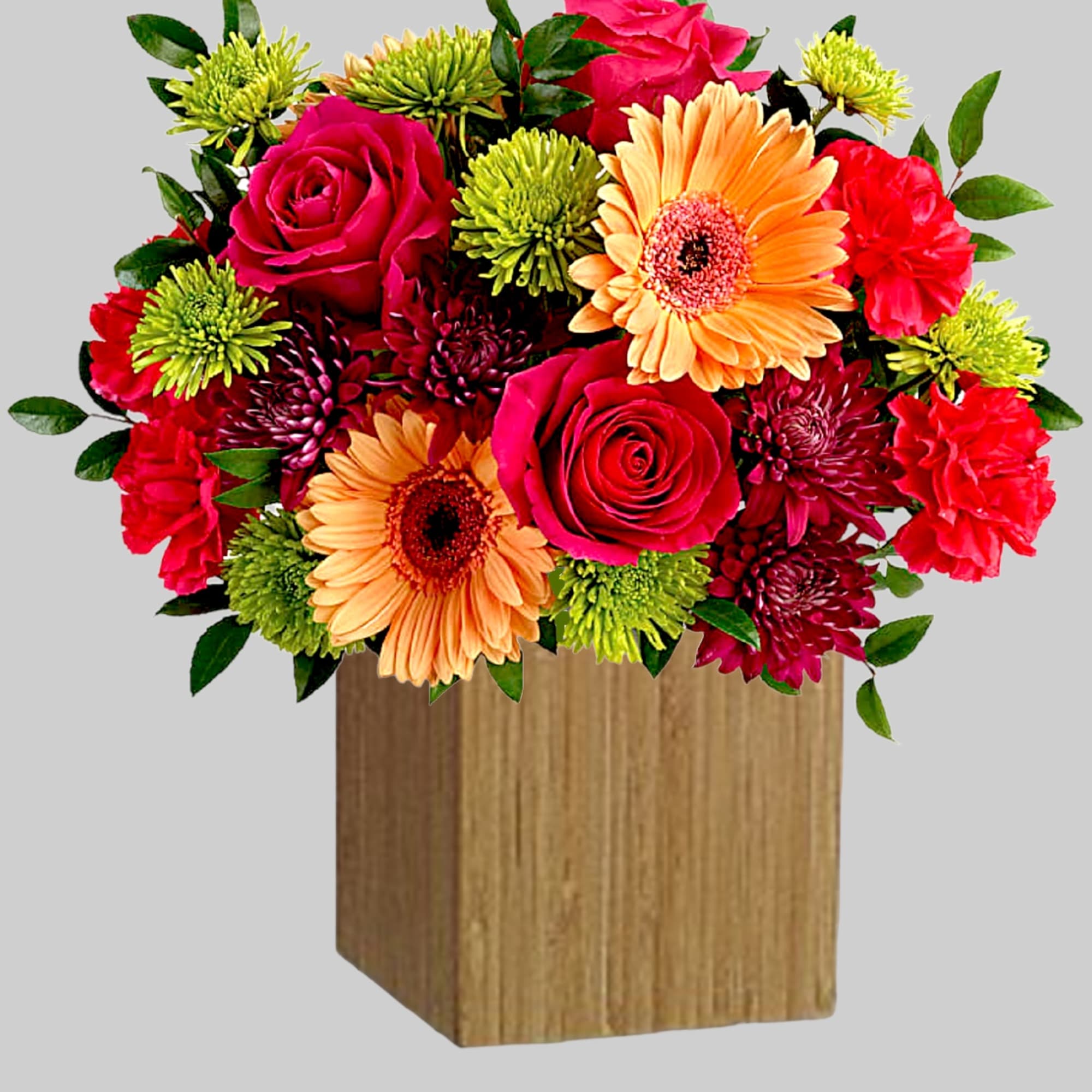 Mixed bouquet of roses, gerbera daisies, and mums in a wooden box
