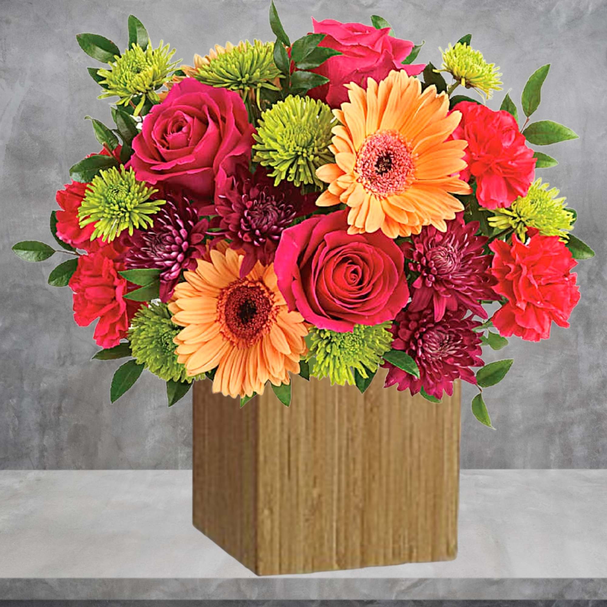 Bright mixed bouquet in a wooden cube vase with roses and gerbera daisies, photo 3 of 5